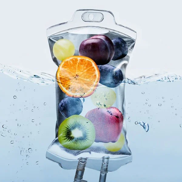 IV bag holding fruits to represent nutrients in the IV