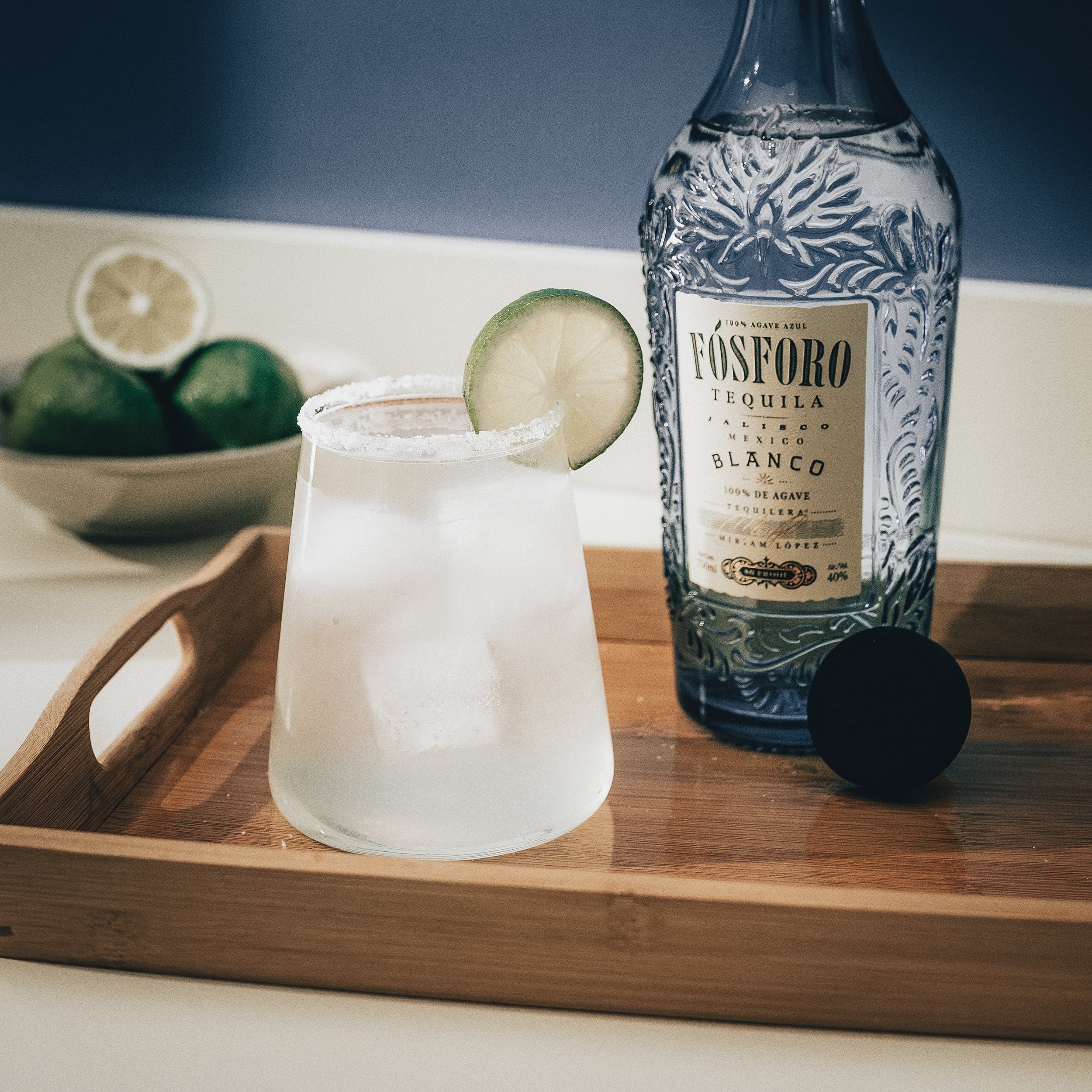 Classic margarita with tequila, lime, and salted rim served over ice in a rocks glass