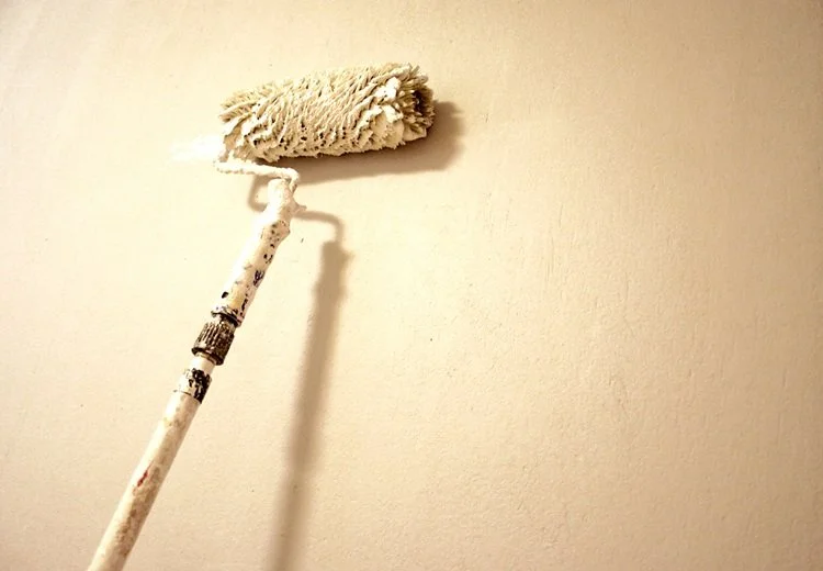 Painting wall with paint roller