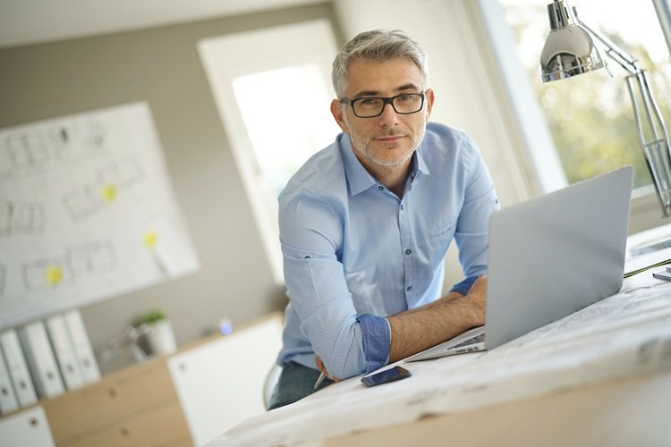 Man at desk with a laptop computer