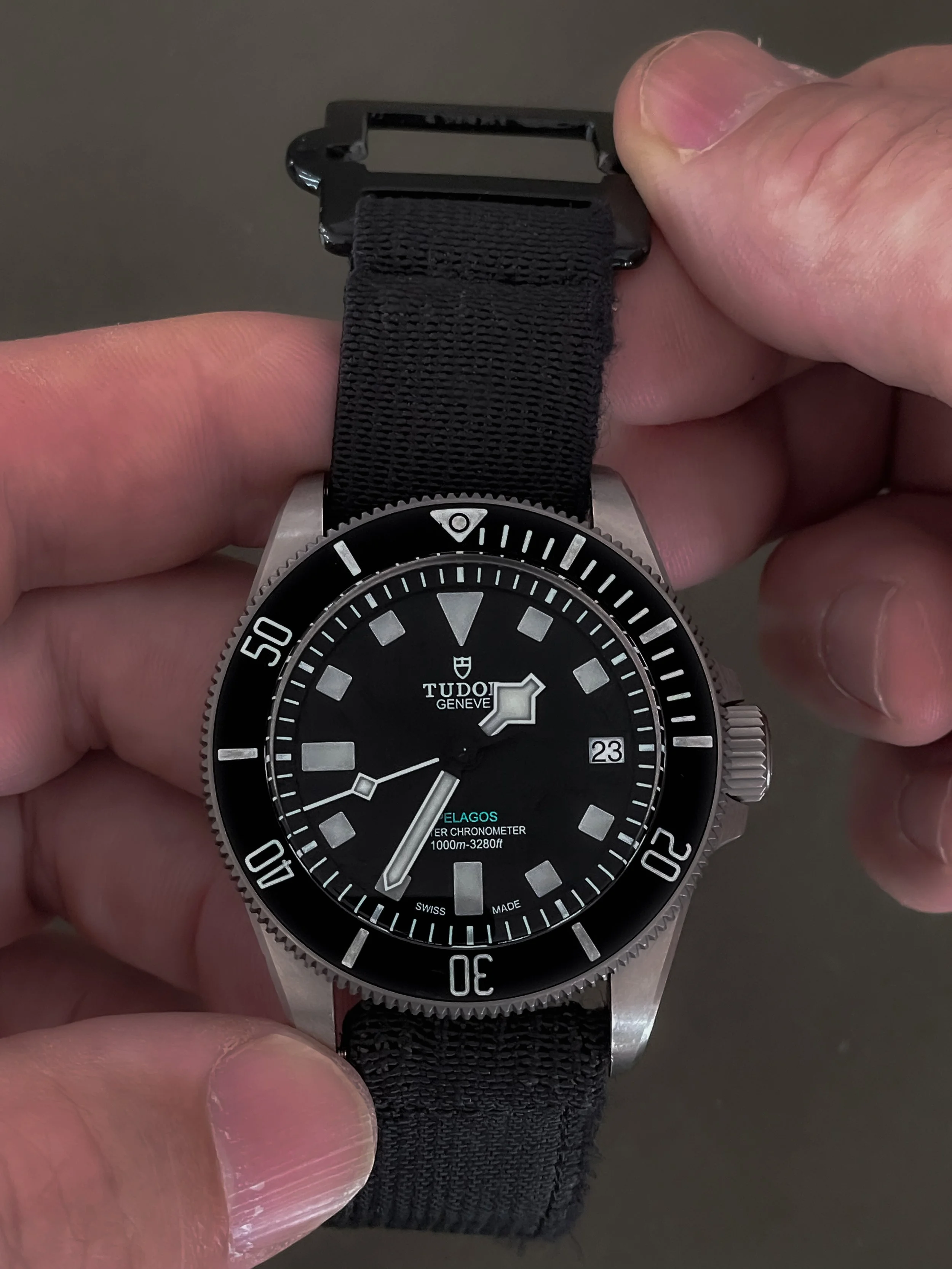 Installing Aquaborne System-21 HALOPARA R-Spec watch strap on a black dive watch.