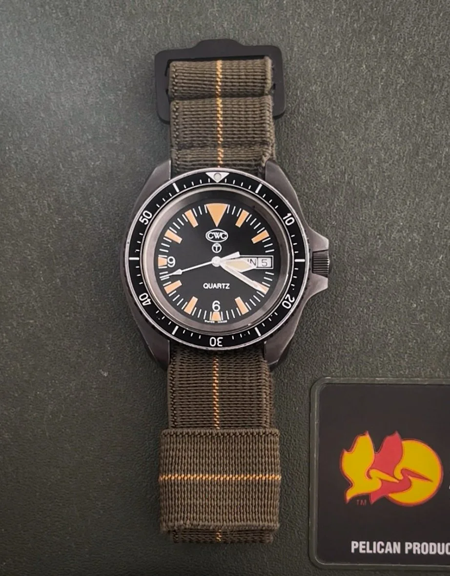 Aquaborne System-21 Breacher strap recon green with yellow tracer mounted on a black dive watch showing single pass construction and keeper design