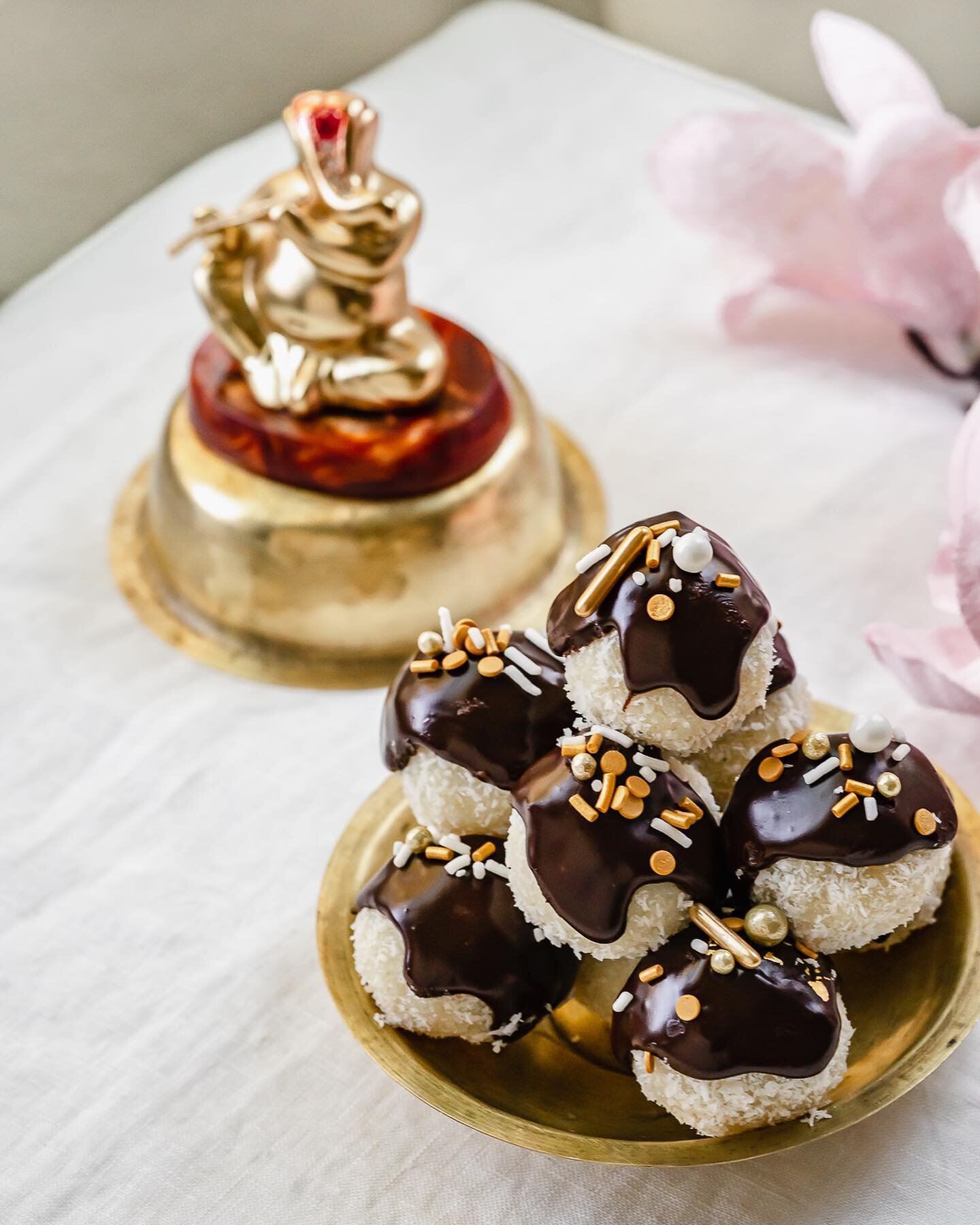 Coconut 🥥 Laddoos with Chocolate Ganache drizzle for Ganesh&rsquo;s birthday. 

Ganesh Chaturthi is a 10-day celebration commemorating the birth of Hindu God Ganesh. Elaborately decorated pandals (temporary display stage) with a statue of Ganesh, is