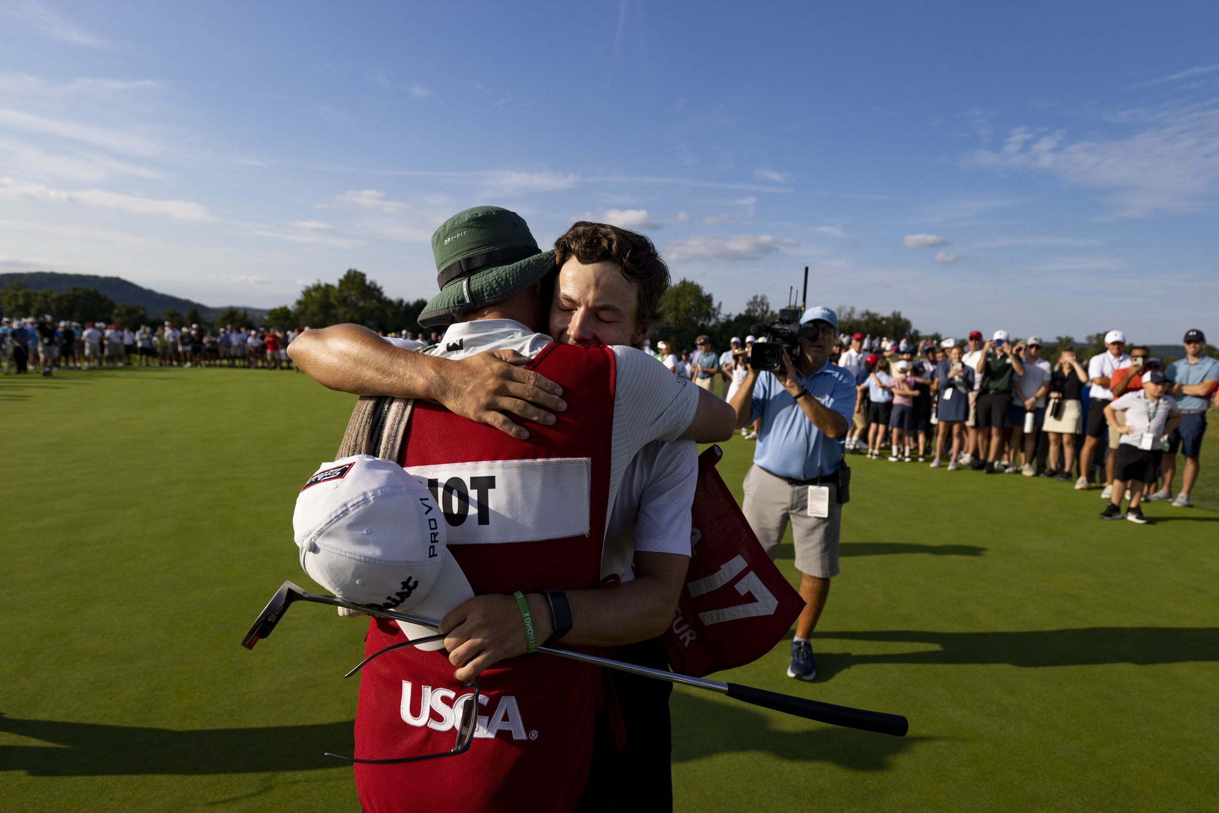 James Piot US Am hugs caddie Dan Ellis.jpg