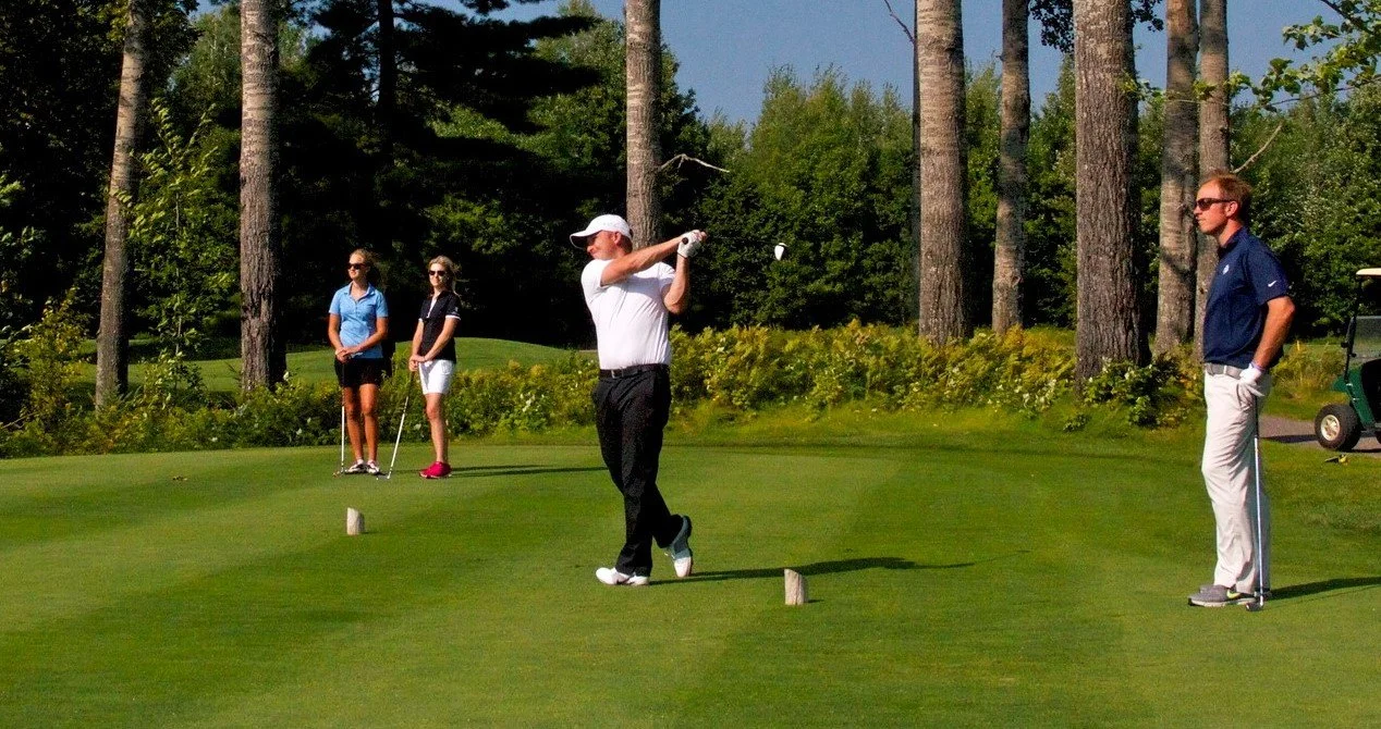 women and men golfing.jpg