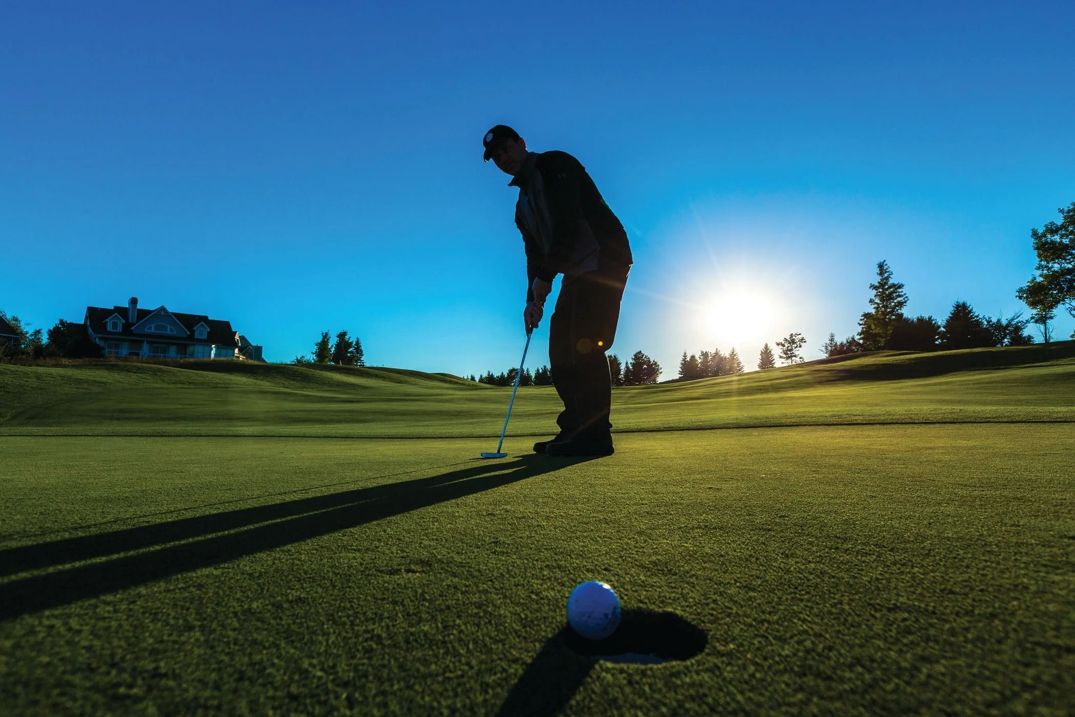 Generic golfer dropping a putt.jpeg