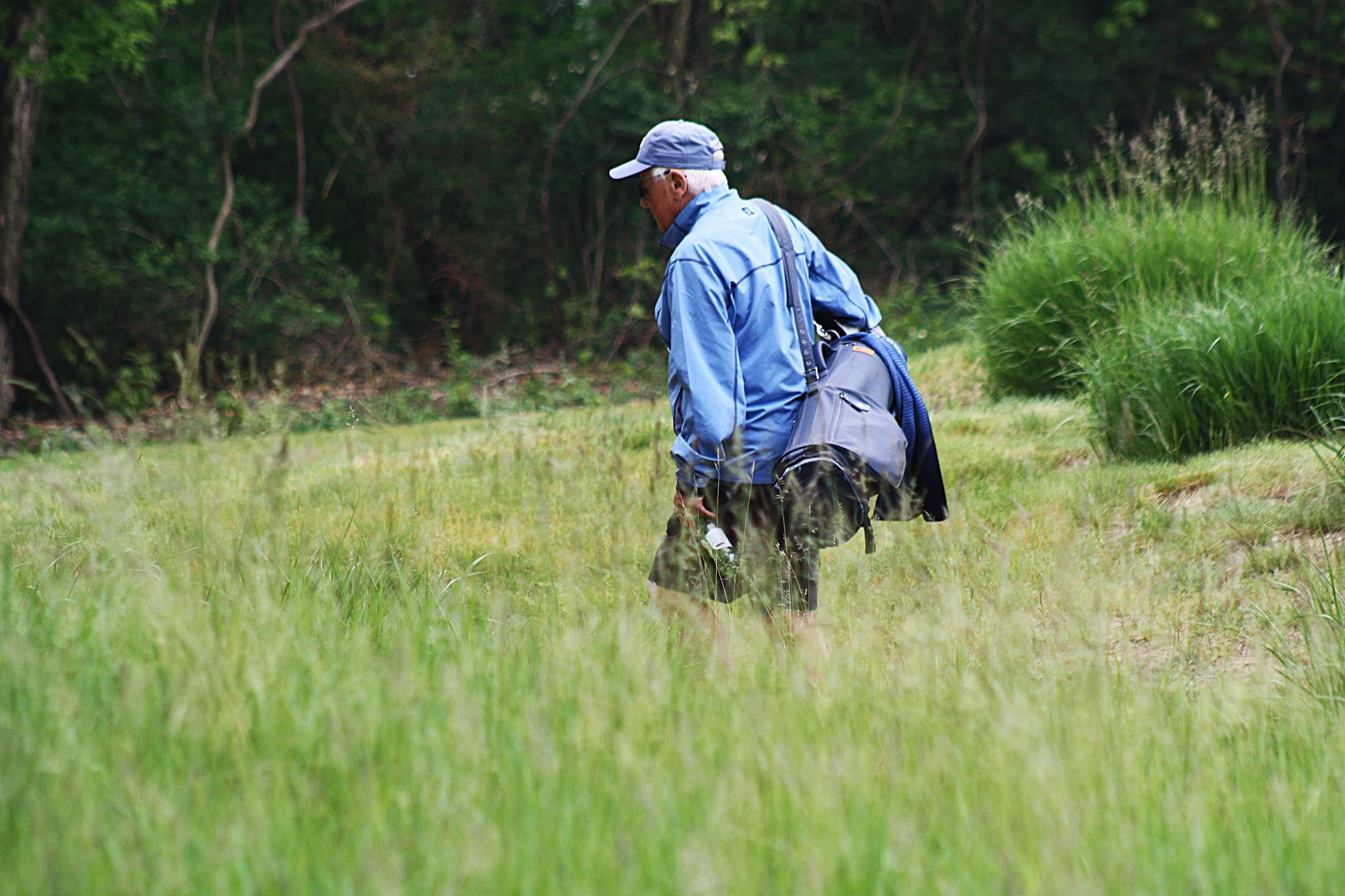 Caddie Joe walking between holes.JPG