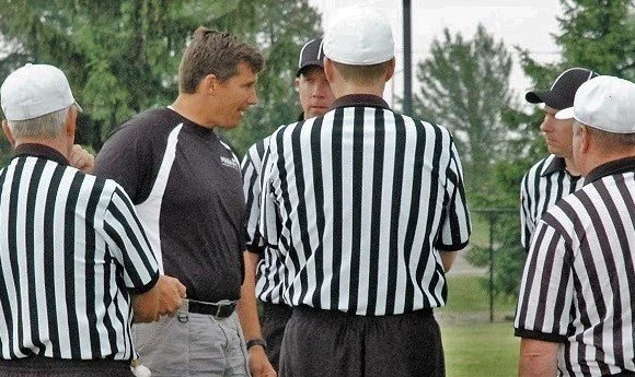 Mark Uyl talking to football refs.jpg
