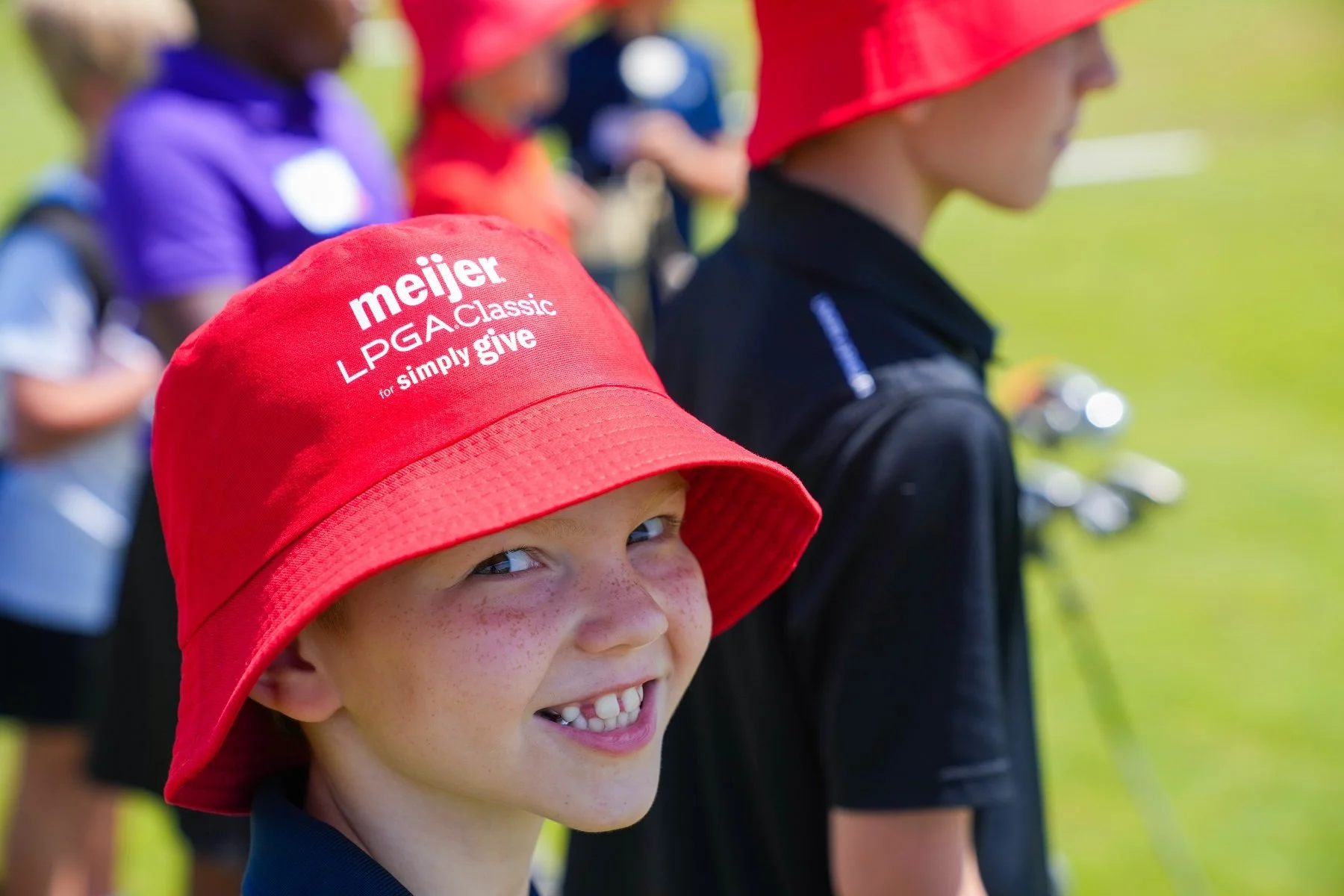 Meijer kid with red hat close up.resized.jpg
