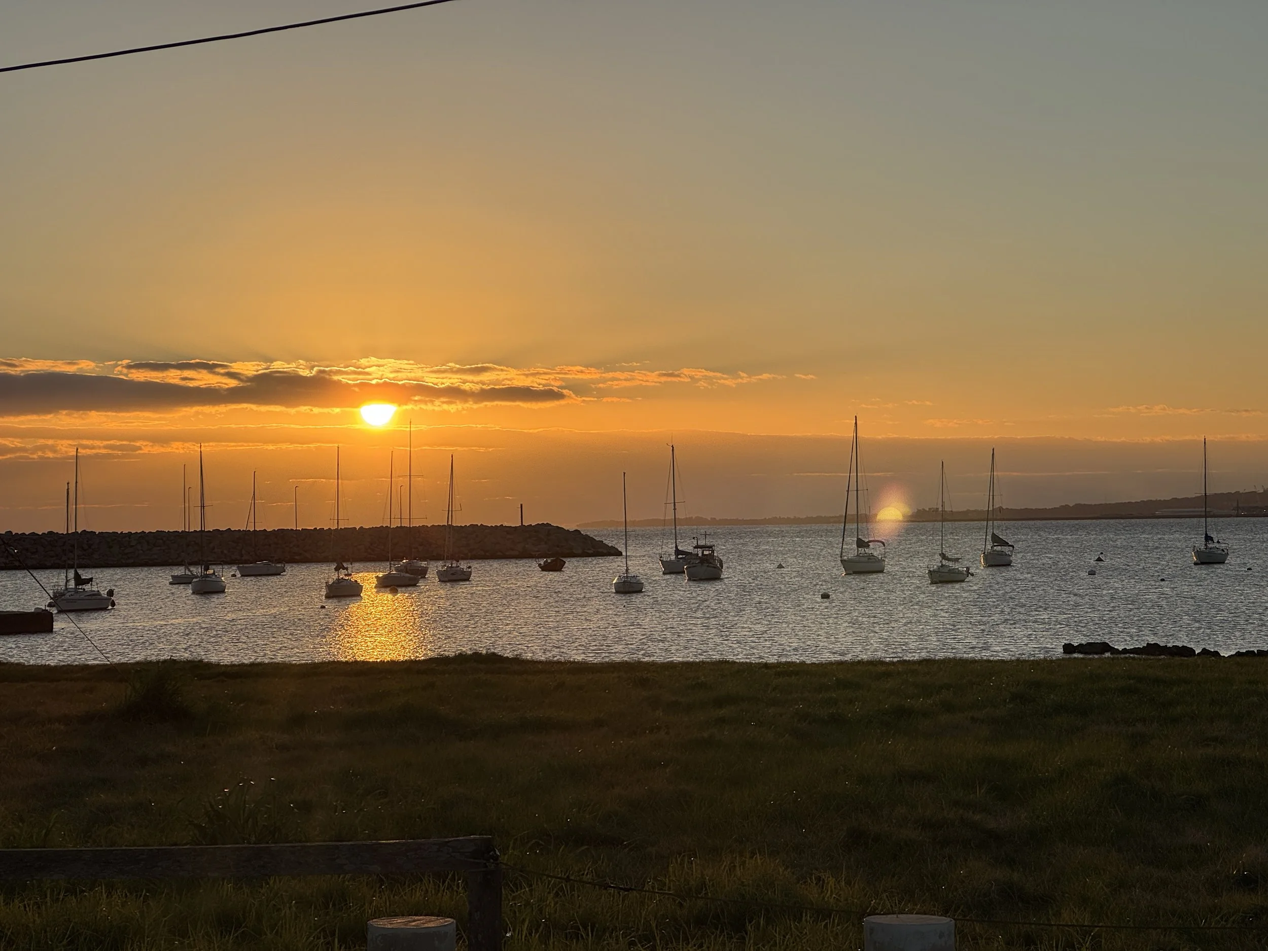 Orange over the boats