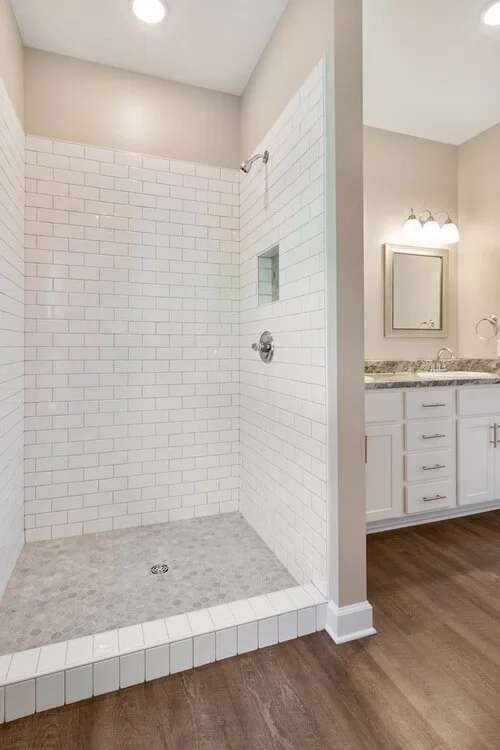 Classic new construction shower — The Tile Store, Inc.