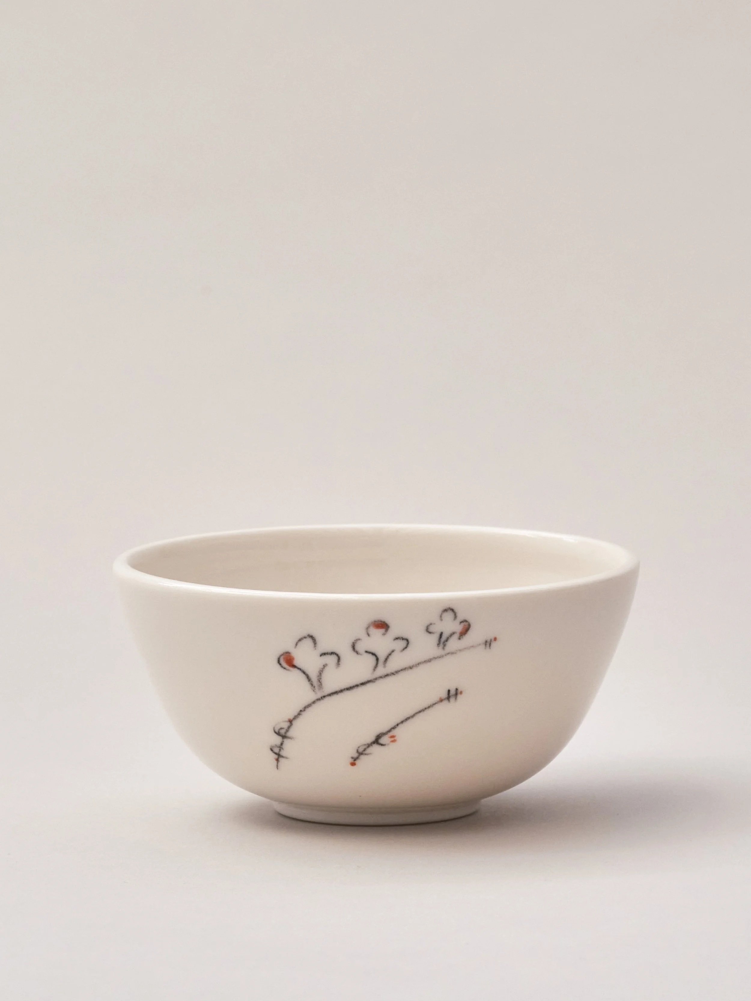 Hand decorated thrown porcelain bowl