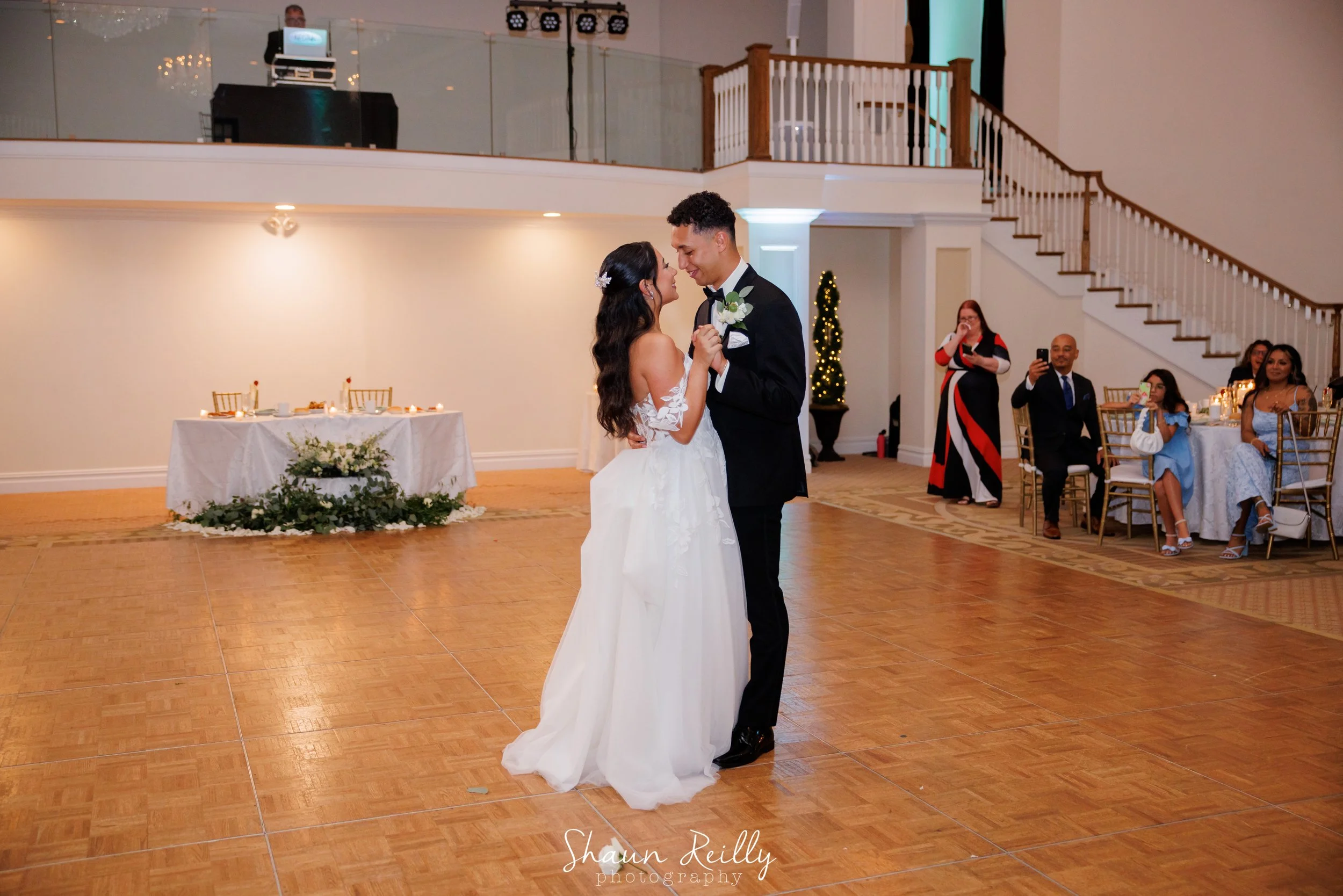bride and groom sweetheart table in back.jpg