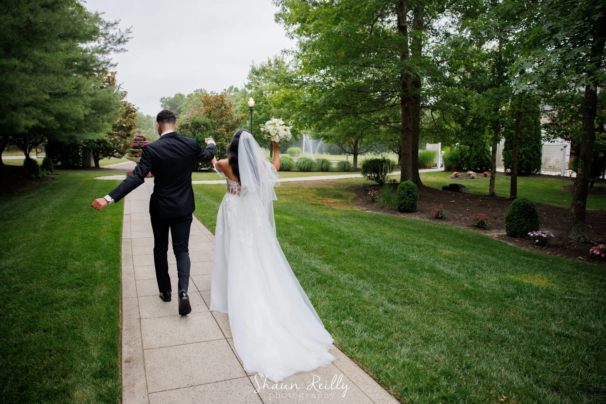 bride and groom just married walking away.jpg