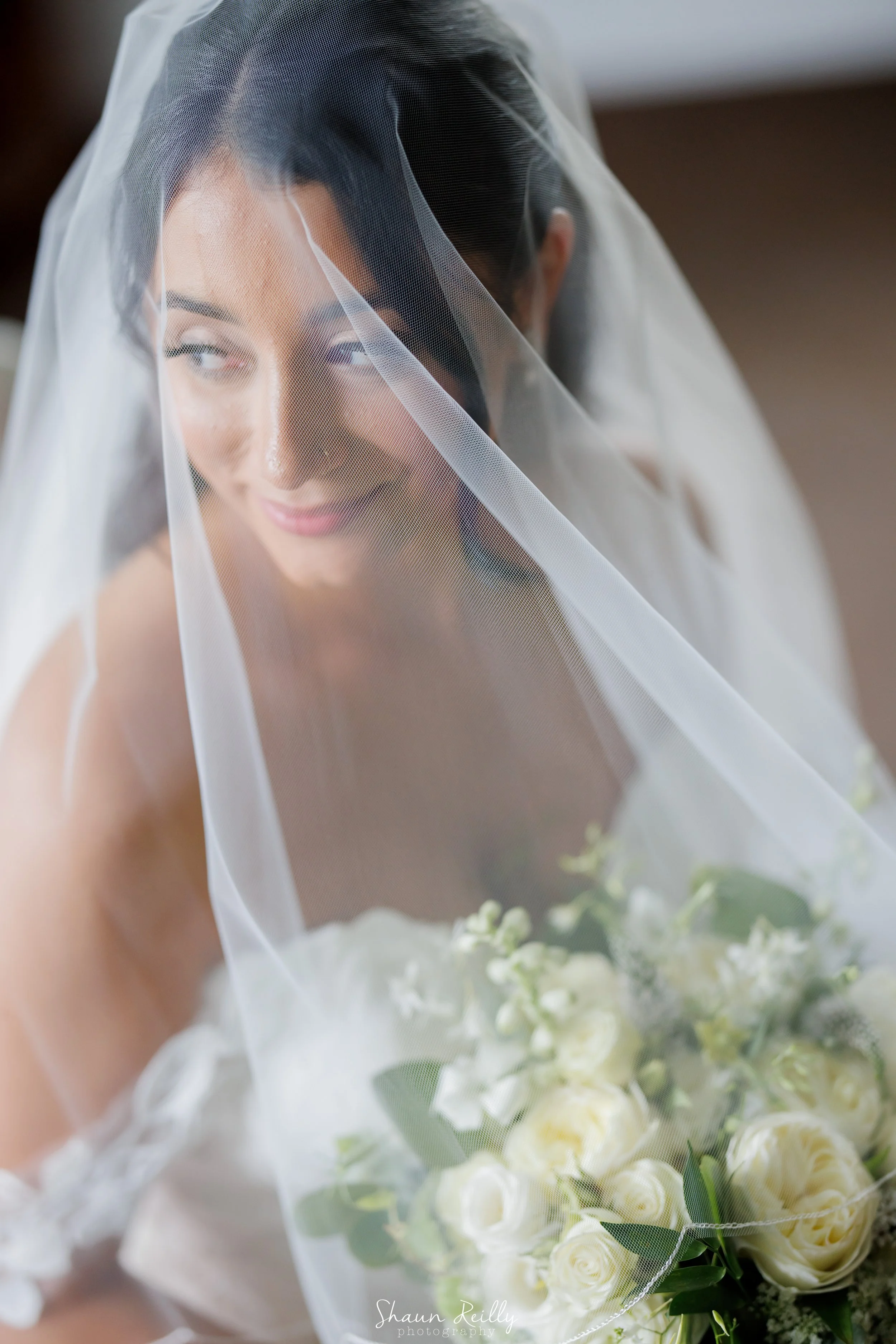 bride with flowers and veil.jpg