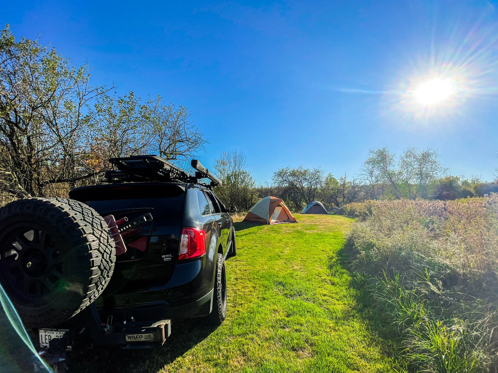 afternoon tent setup with car Autumn GLow Catskills Camping Weekend at Basecamp Brooklyn Estates.JPG