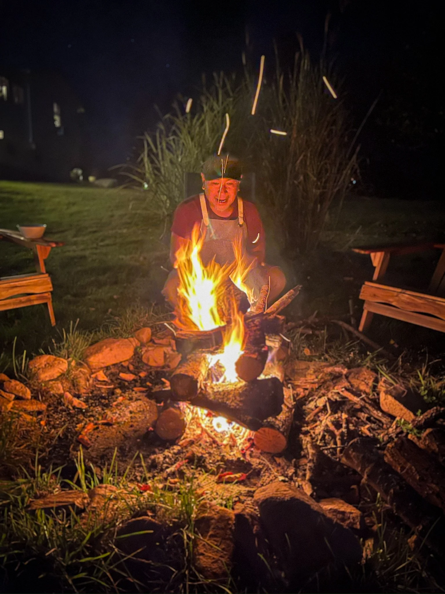 Allan tending the campfire Autumn GLow Catskills Camping Weekend at Basecamp Brooklyn Estates.JPG