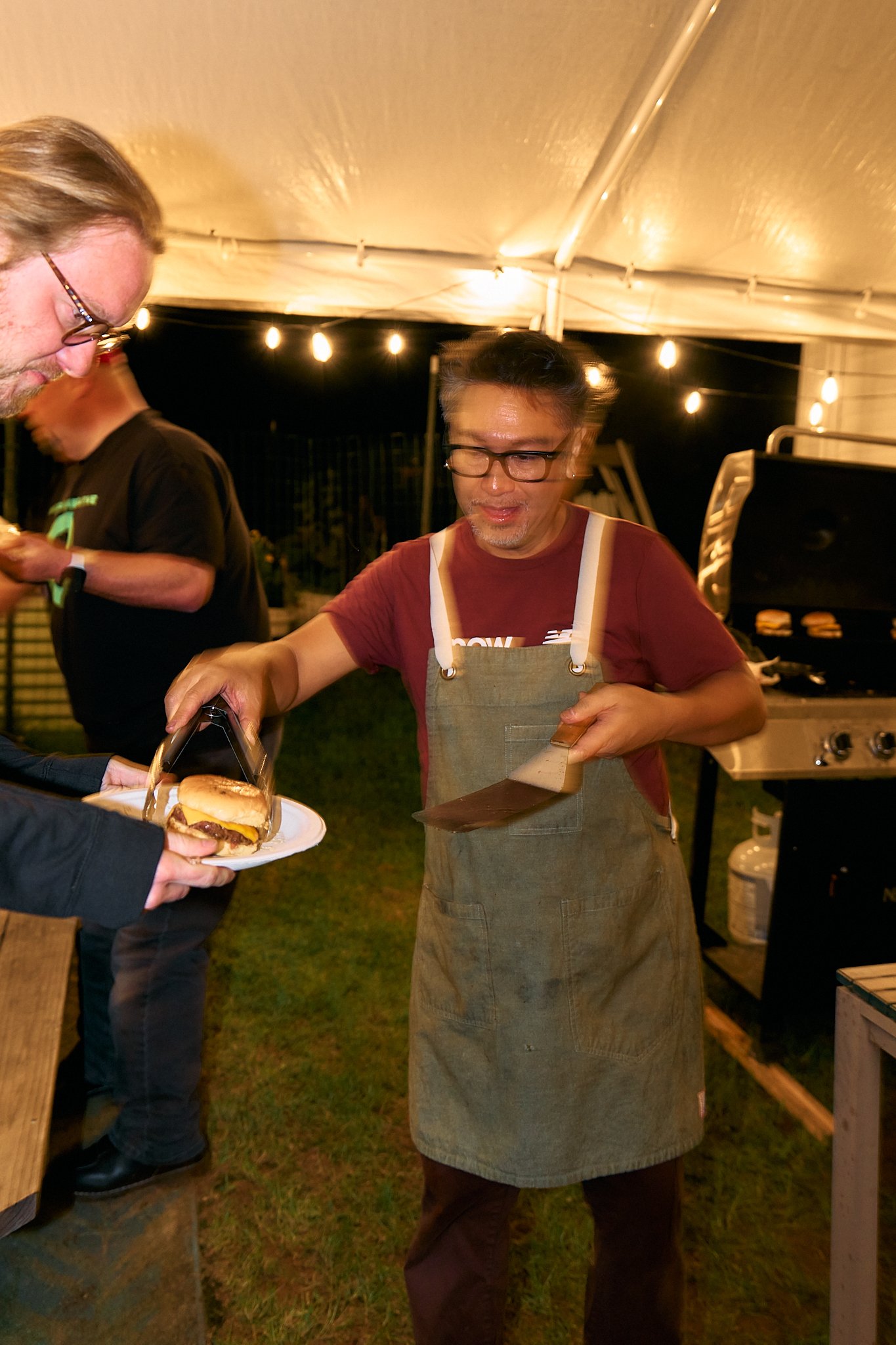 Allan serving Burgers 260912_Basecamp Brooklyn 144_Max Lemoine.jpg