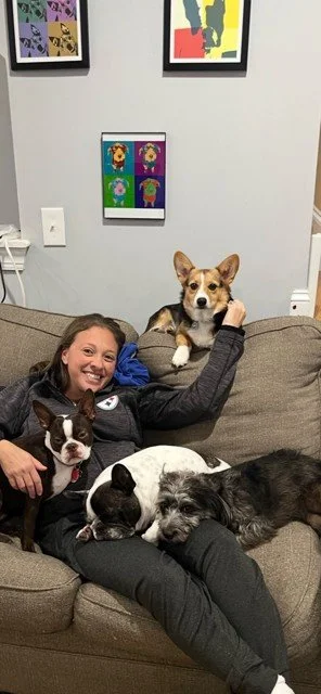 Pet communicator Brandi Van relaxing at home with her dogs.