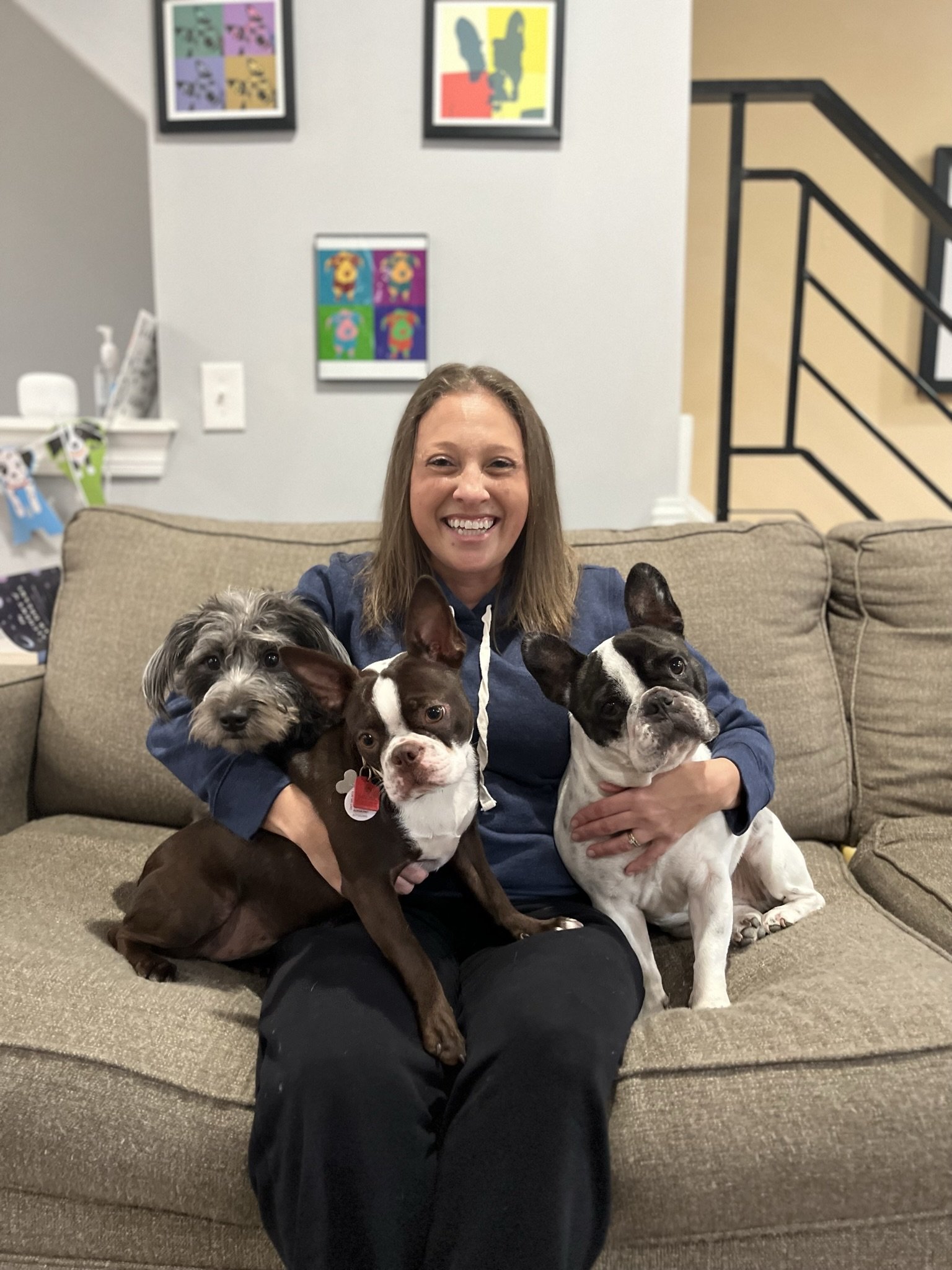 Brandi Van with her dogs, showcasing her chapter in The Intuitive’s Oracle on telepathic pet communication and intuitive development.
