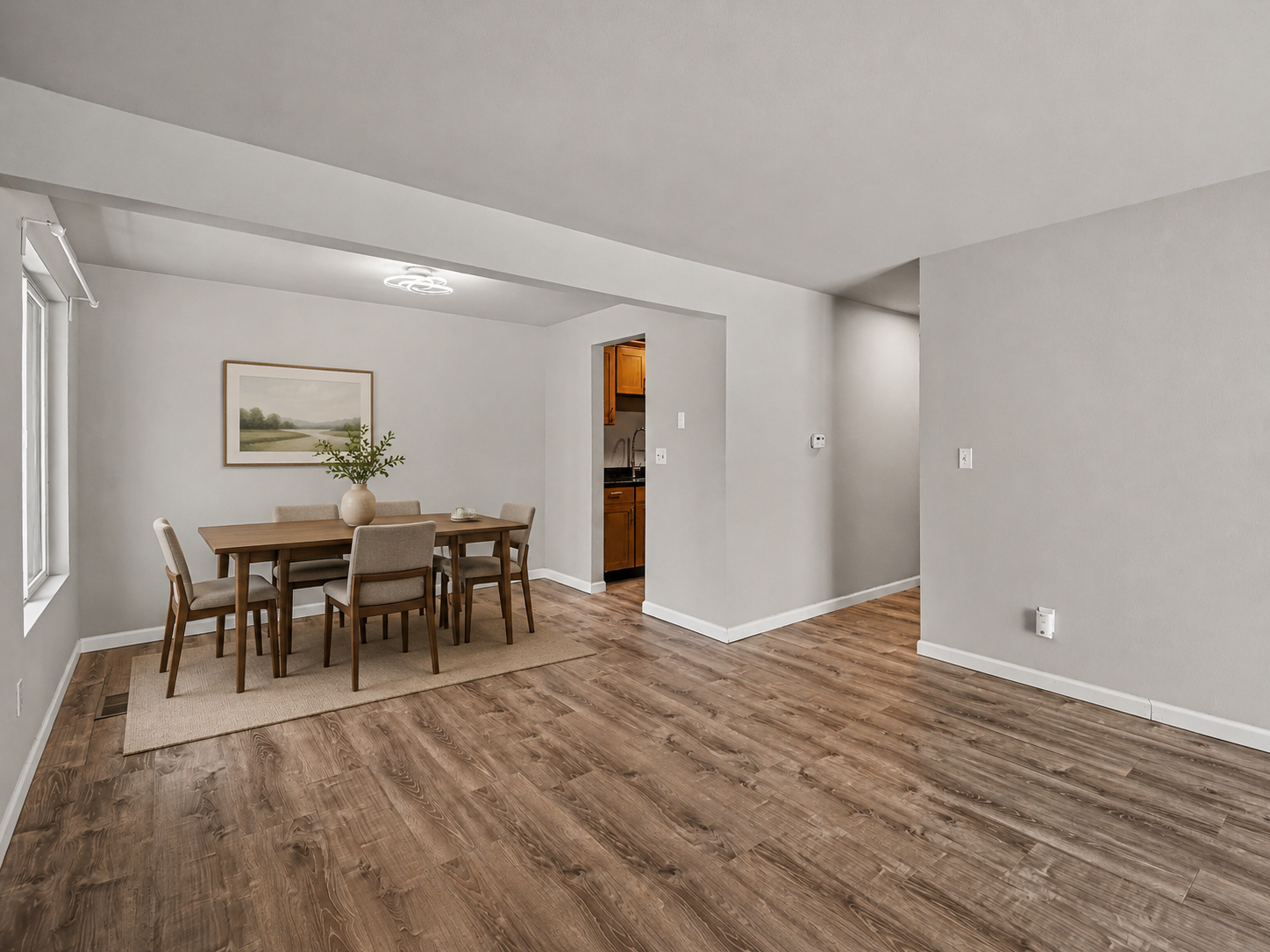 Virtually staged dining area with brand-new Lifeproof LVP premium flooring