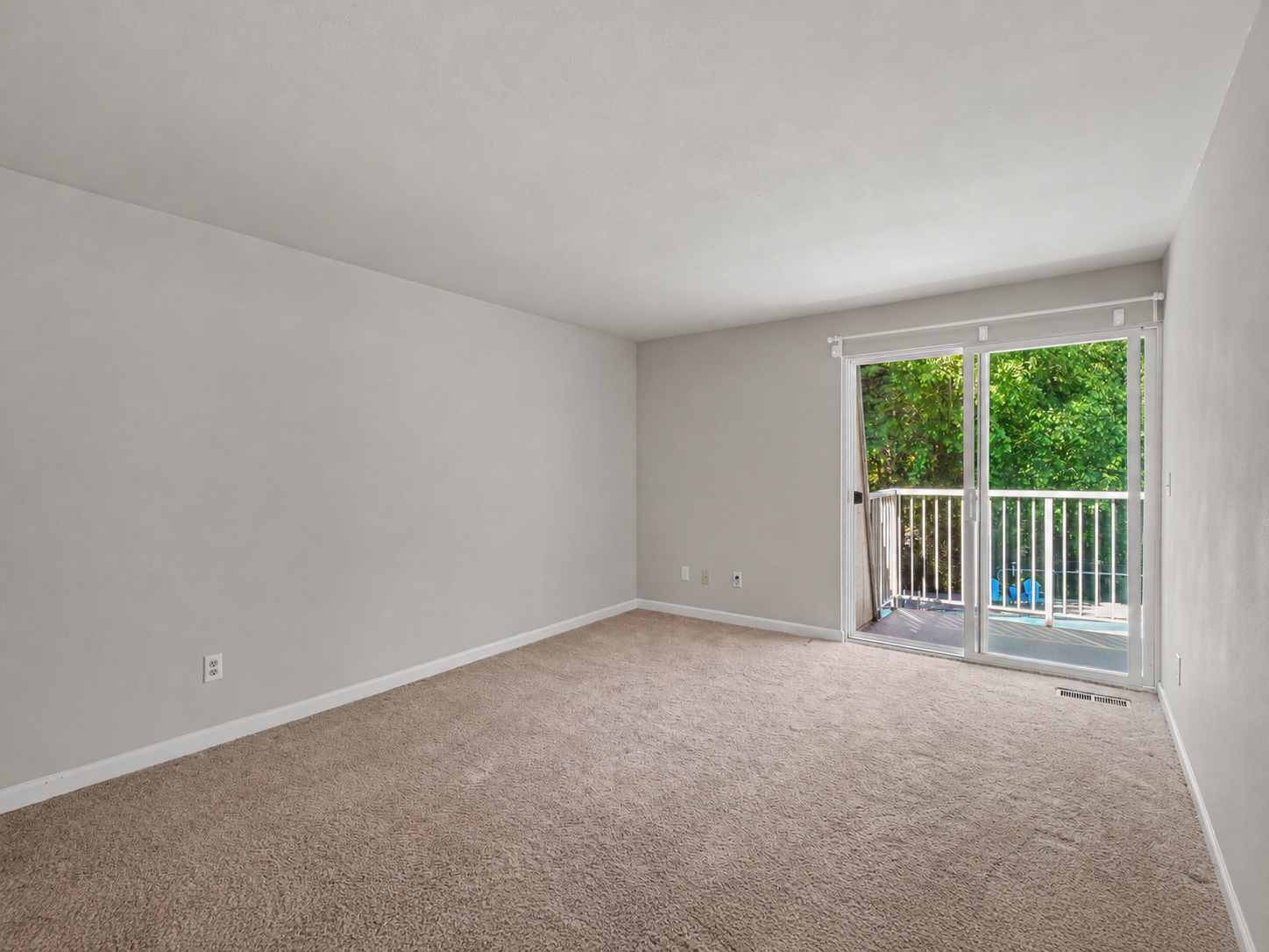 Primary bedroom with slider to back balcony