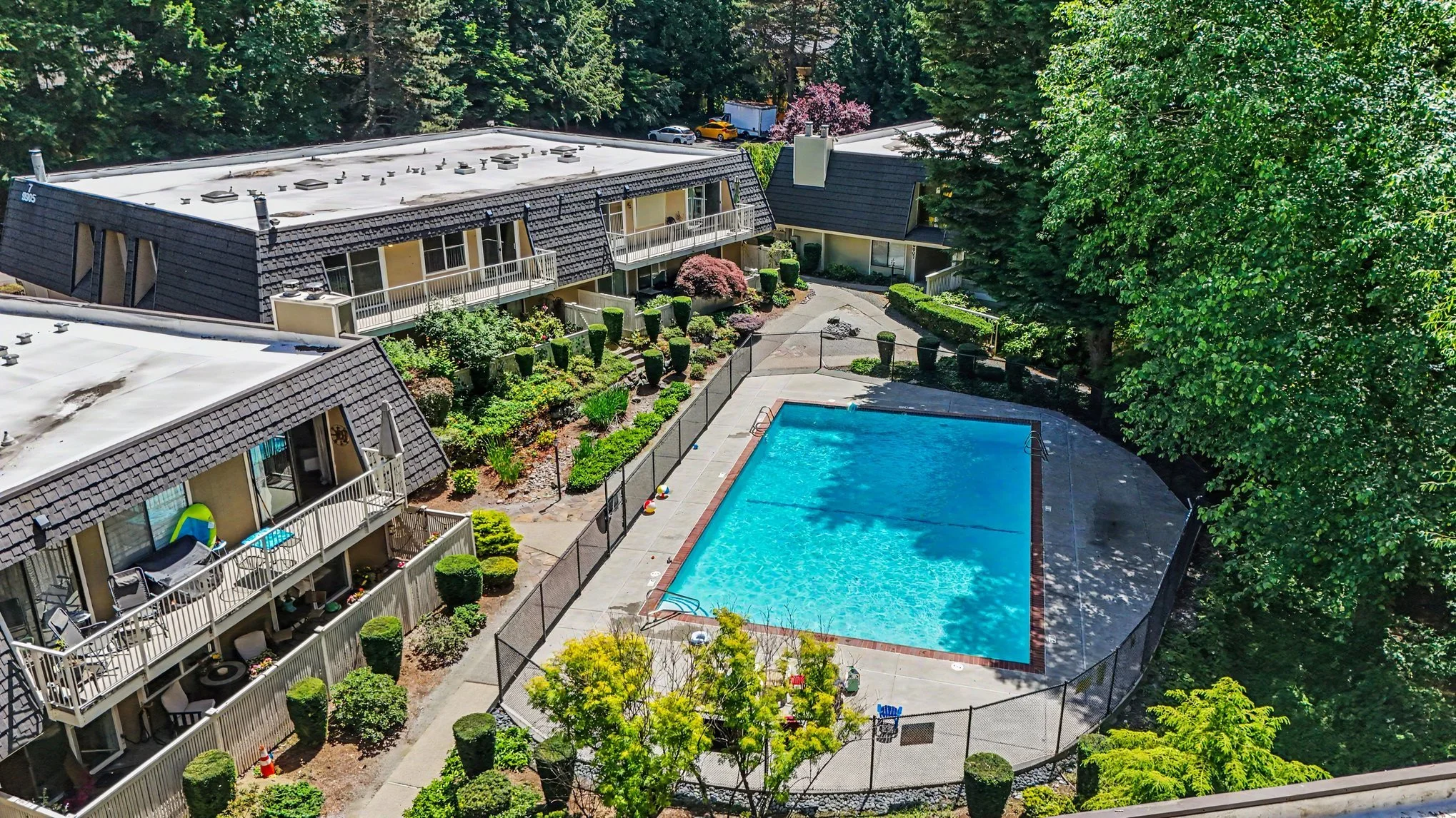 Back of condo, pool area and greenbelt