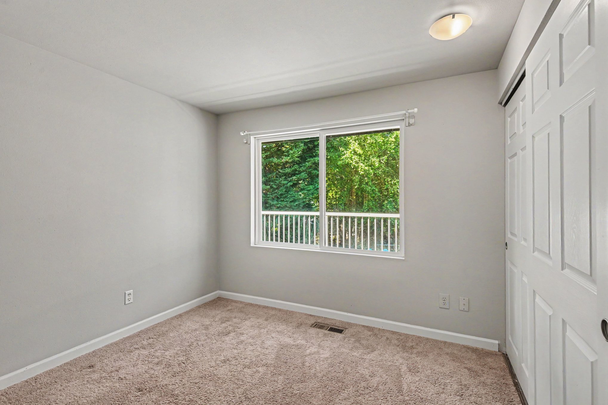 
Bedroom 2 with view of pool and greenbelt view 2