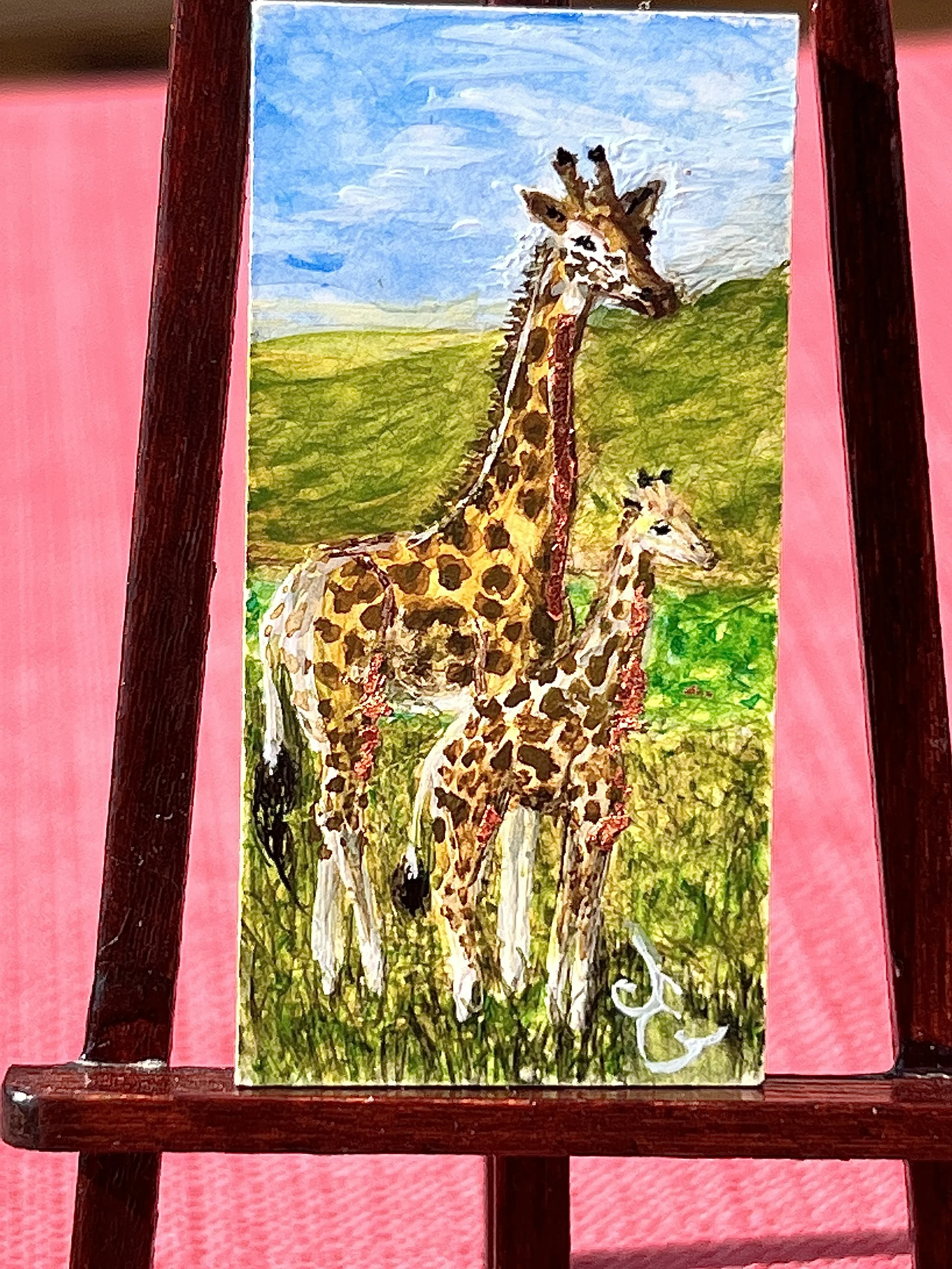 Giraffe mama and giraffe calf