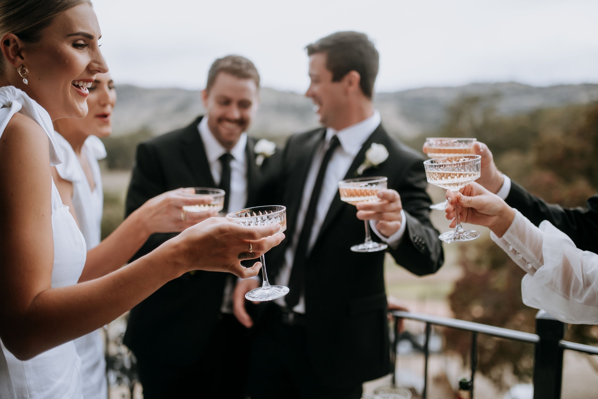 Bridal Party Cheers Balcony.jpg