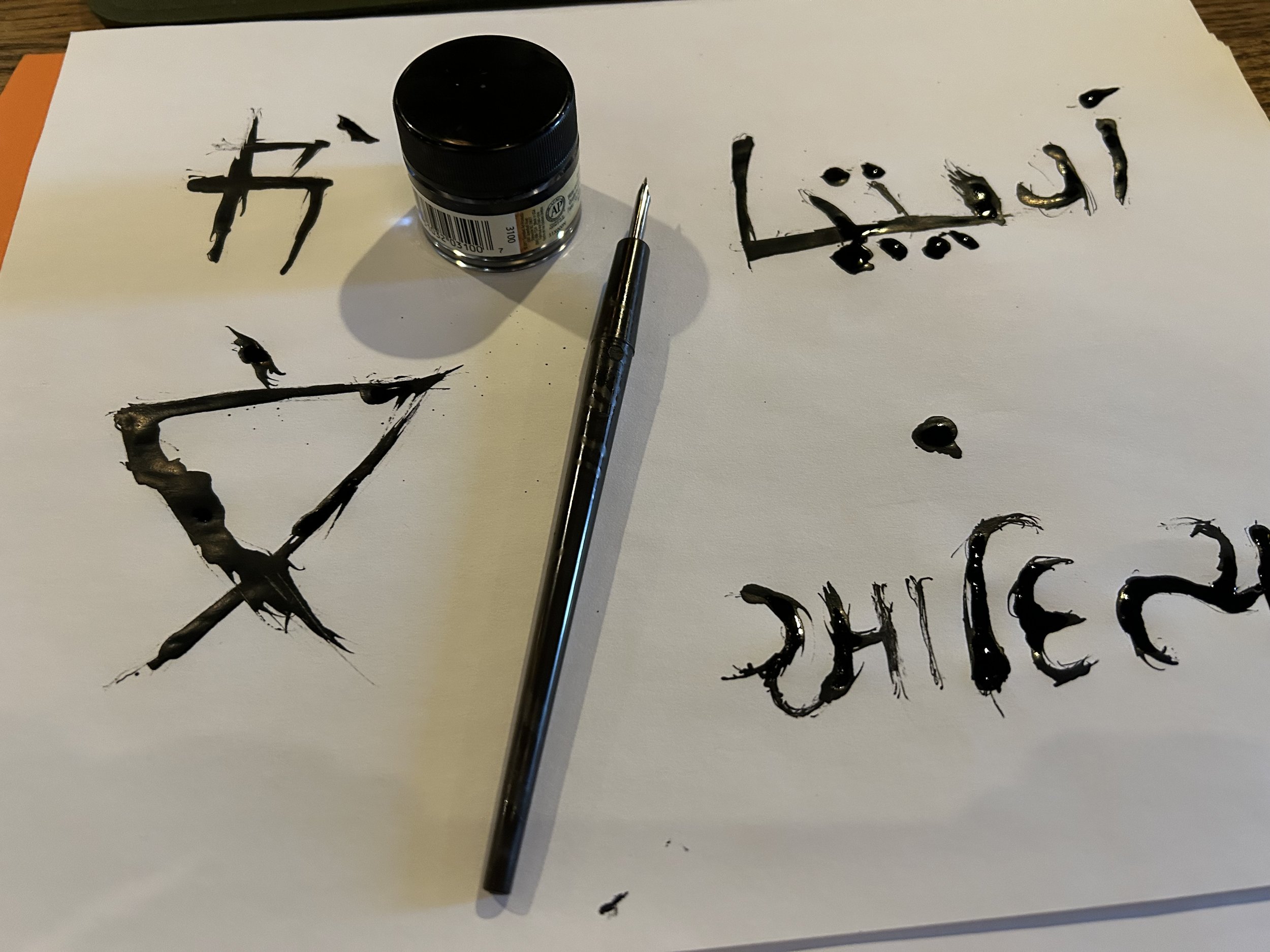 Image of final repeated with pen and inkwell