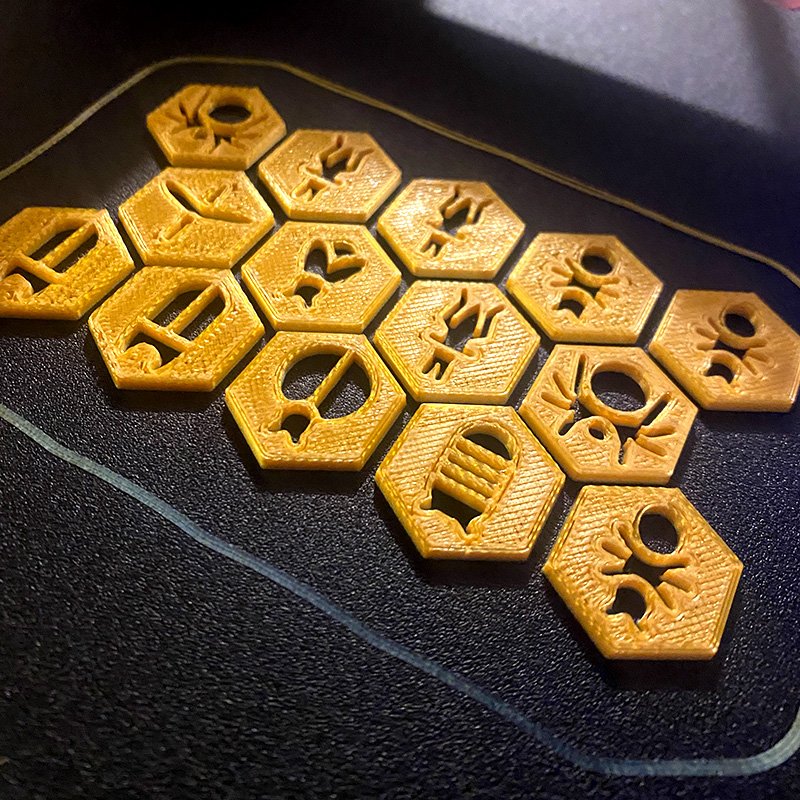 Here are some game pieces for a version of the game "Hive". They're hot off the press.