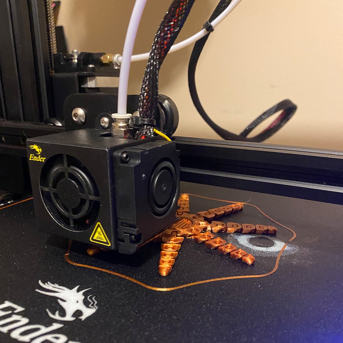 Another action shot of a Roctopus print in the works. I have my printing set up in a way where the printer takes a few passes around the item that is printed to make sure that the bed is level with the nozzle. If the nozzle is too close it gets jamme