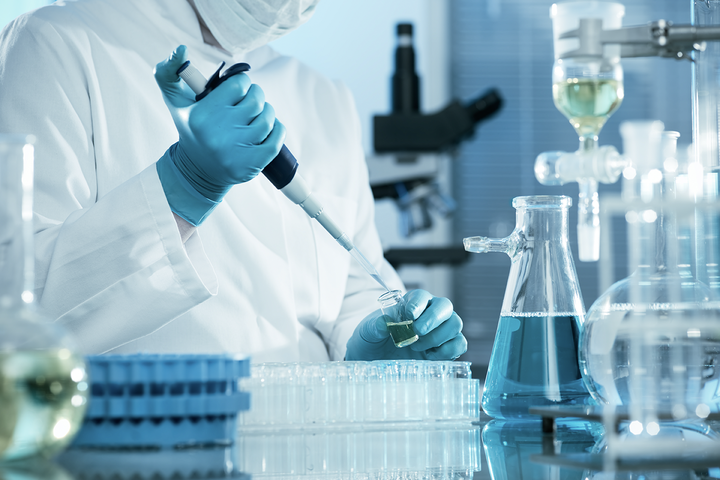 Close focus on person woking in Laboratory with specialised equipment