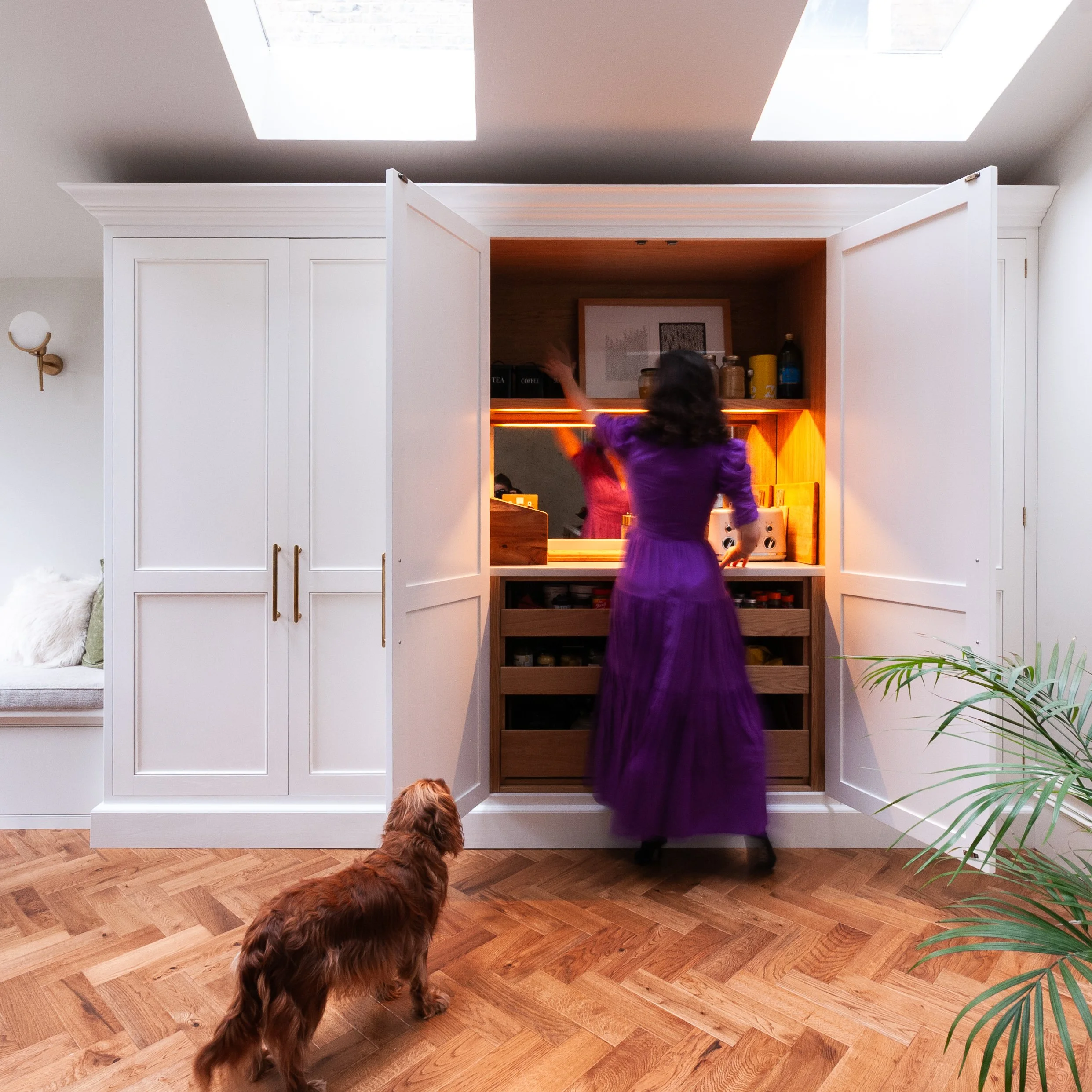 Bespoke kitchen in Herne Hill with open pantry larder storage, warm internal lighting and everyday family use.