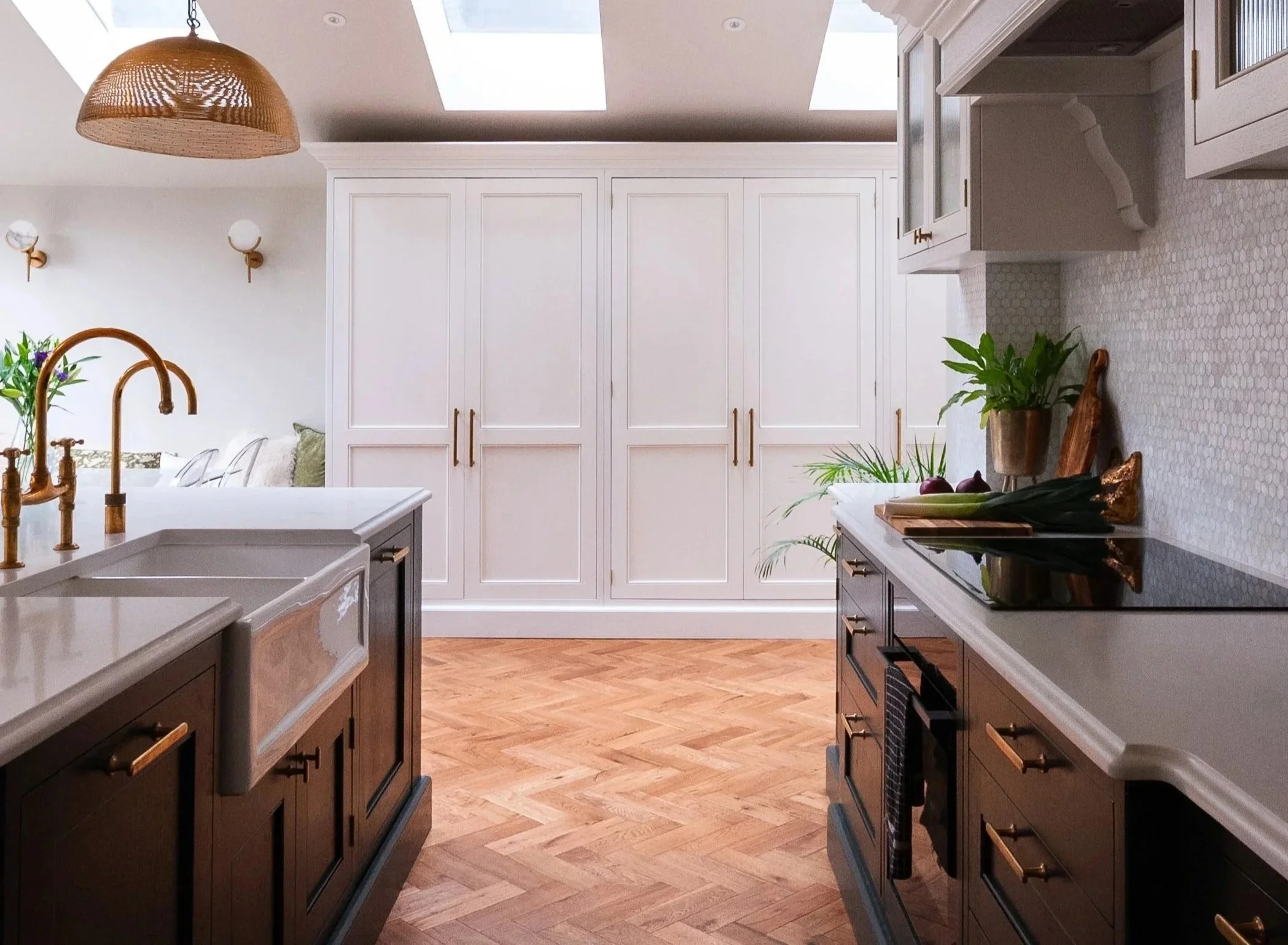 Bespoke kitchen in Herne Hill showing kitchen layout, circulation space, skylights and connection to the wider dining area.