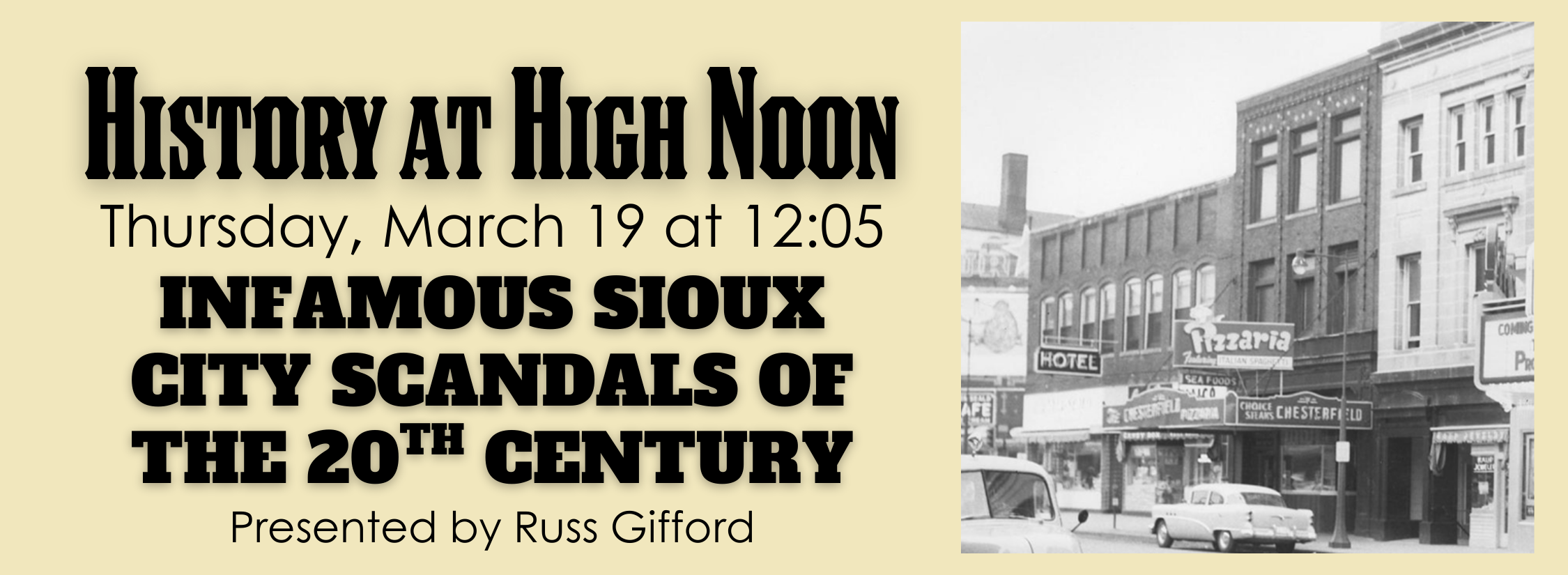 A historic downtown line of buildings with a prominent pizzaria sign