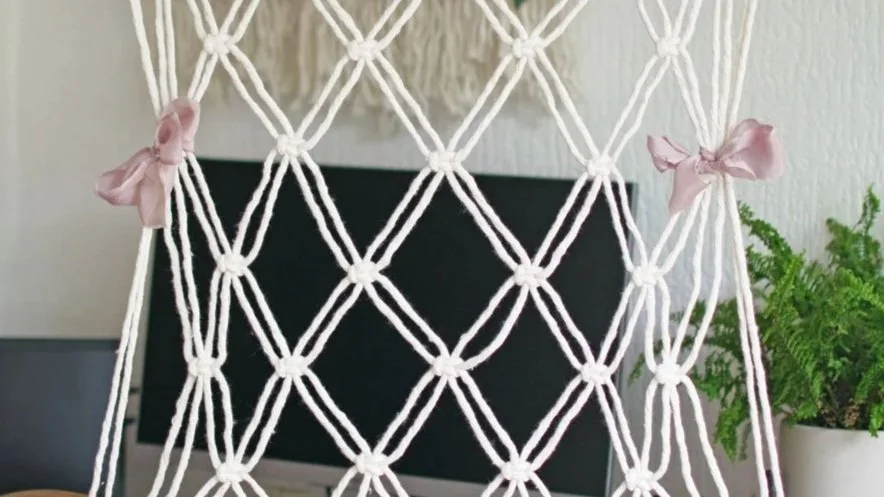 pink ribbon on macrame wedding display