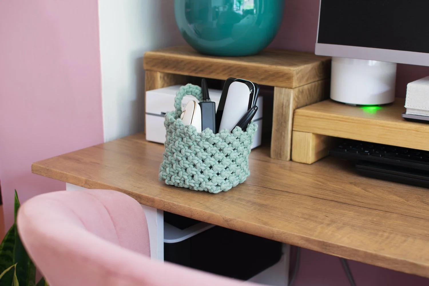 green macrame basket on clean office desk