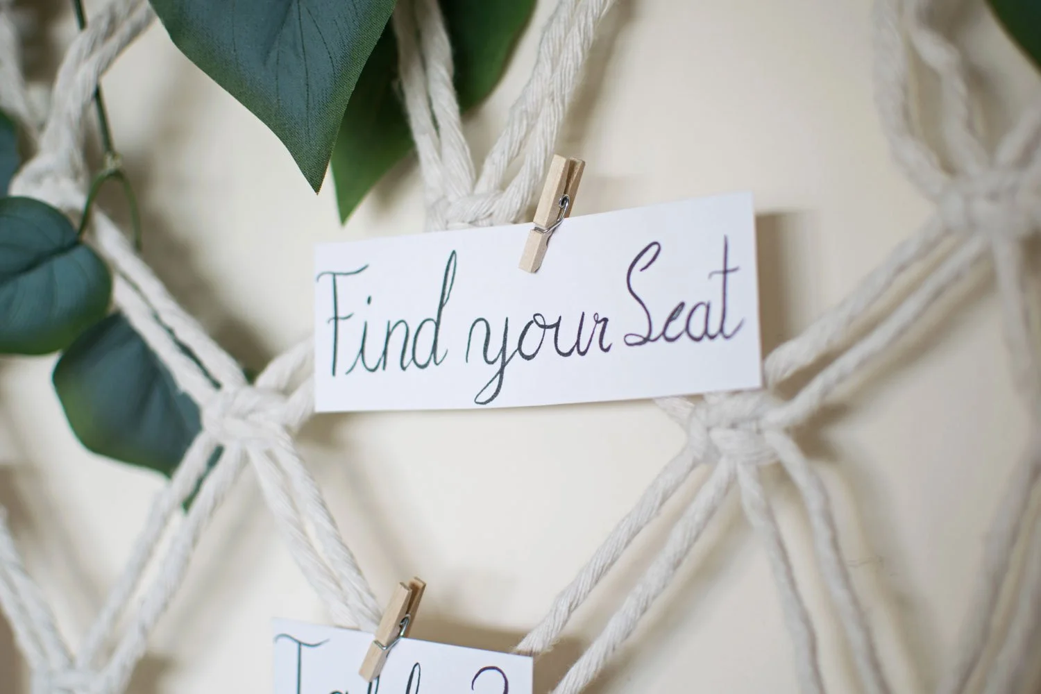 find your seat label on macrame table plan display