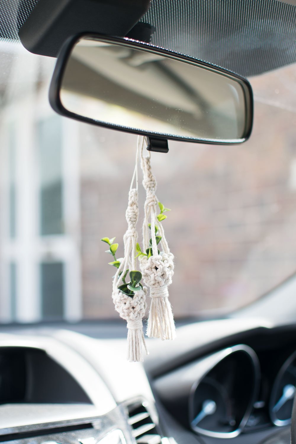 2 mini macrame car charm plant hangers on rear view car mirror