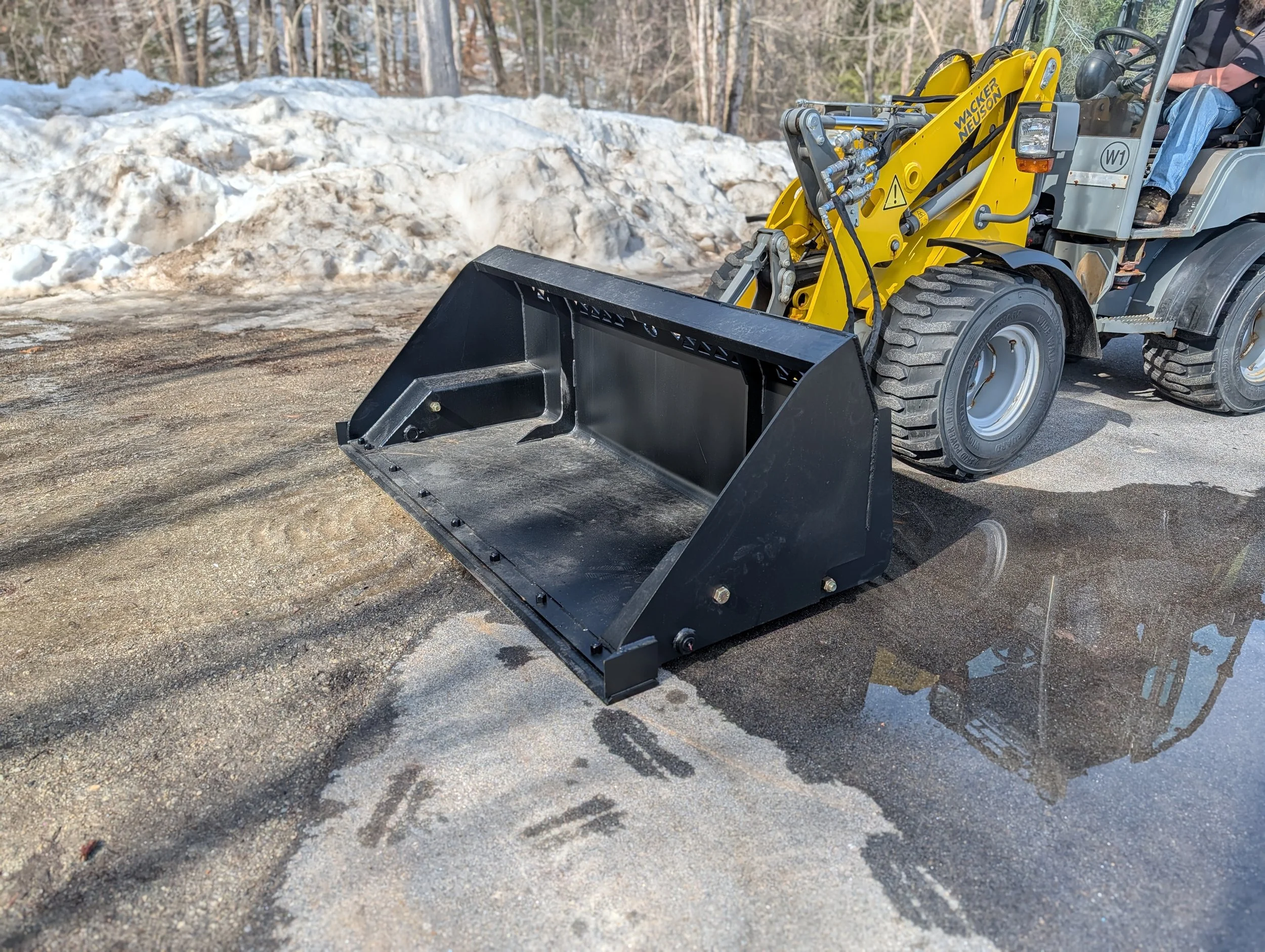 Bucket sitting on ground side front view.jpg
