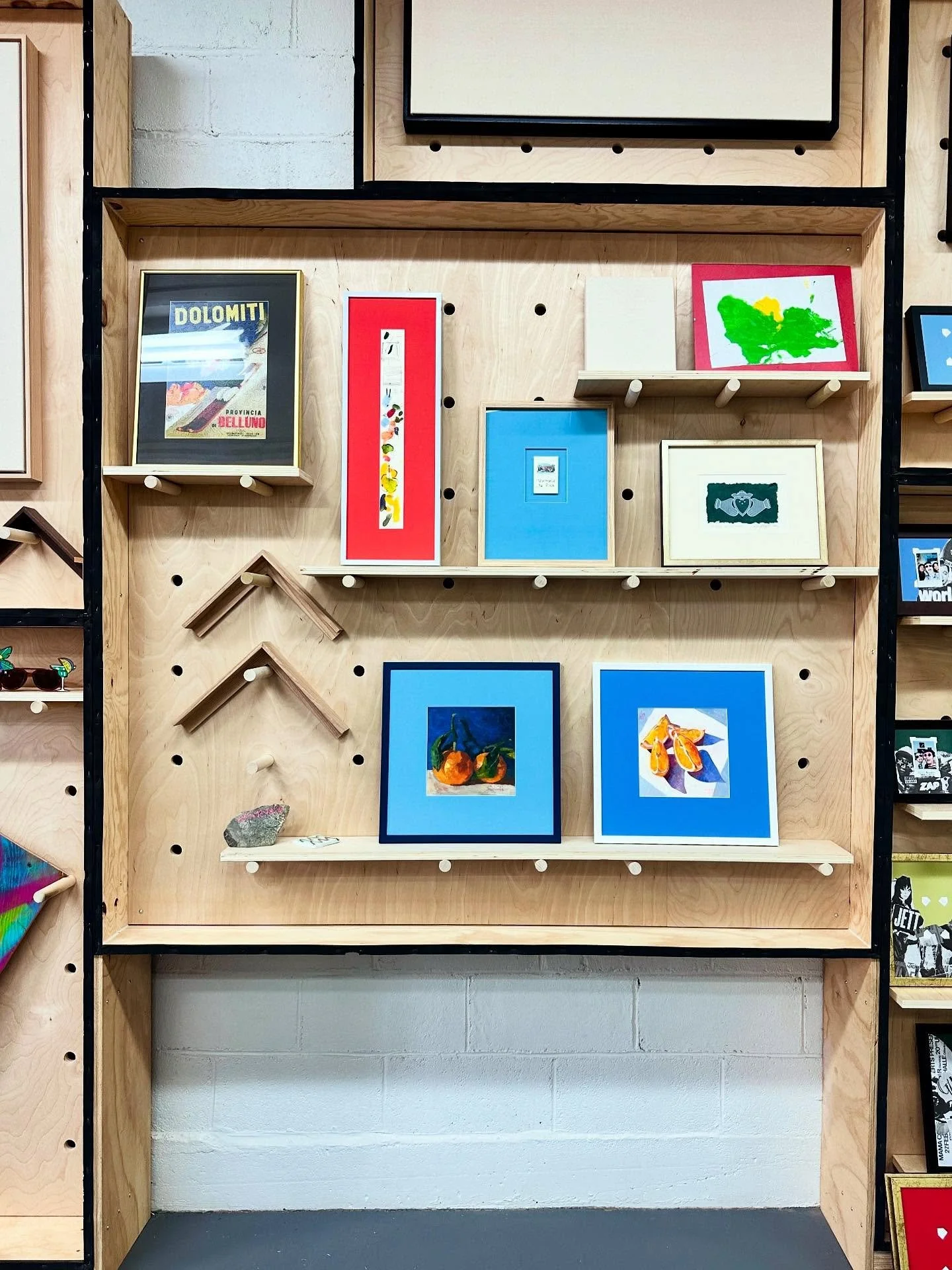 Happy Friday from the bright side of the studio! 🌈🖼️ This little corner of the community wall is showing off some of the bold, beautiful frames that have come through the shop lately &mdash; such a fun project to work on, and even better knowing ea