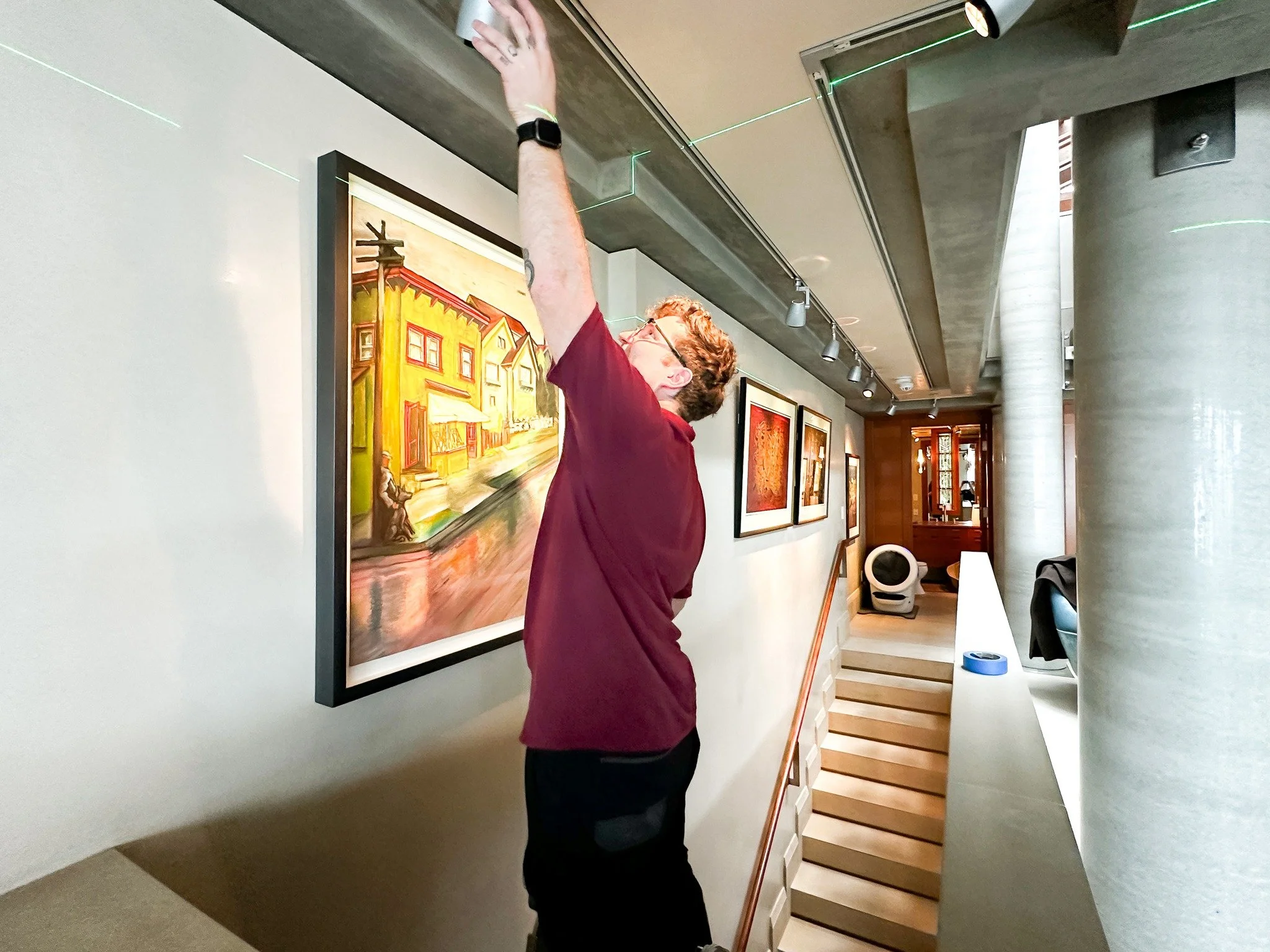 Good art deserves good lighting&mdash;and a little extra attention.
Behind every perfectly placed piece is a ladder, a laser, and someone who really cares.

 #ArtInHomes #BehindTheScenesArt #ArtServices #installerlife #smallbusinessbigheart #bravoart