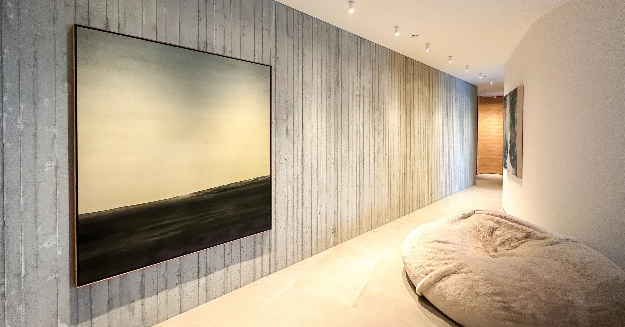 A horizon line, reduced to its essentials.
Takao Tanabe&rsquo;s Prairie Paintings distill landscape into light, tone, and space&mdash;quietly expansive, and deeply considered.
Installed on a textured concrete wall that required just as much attention