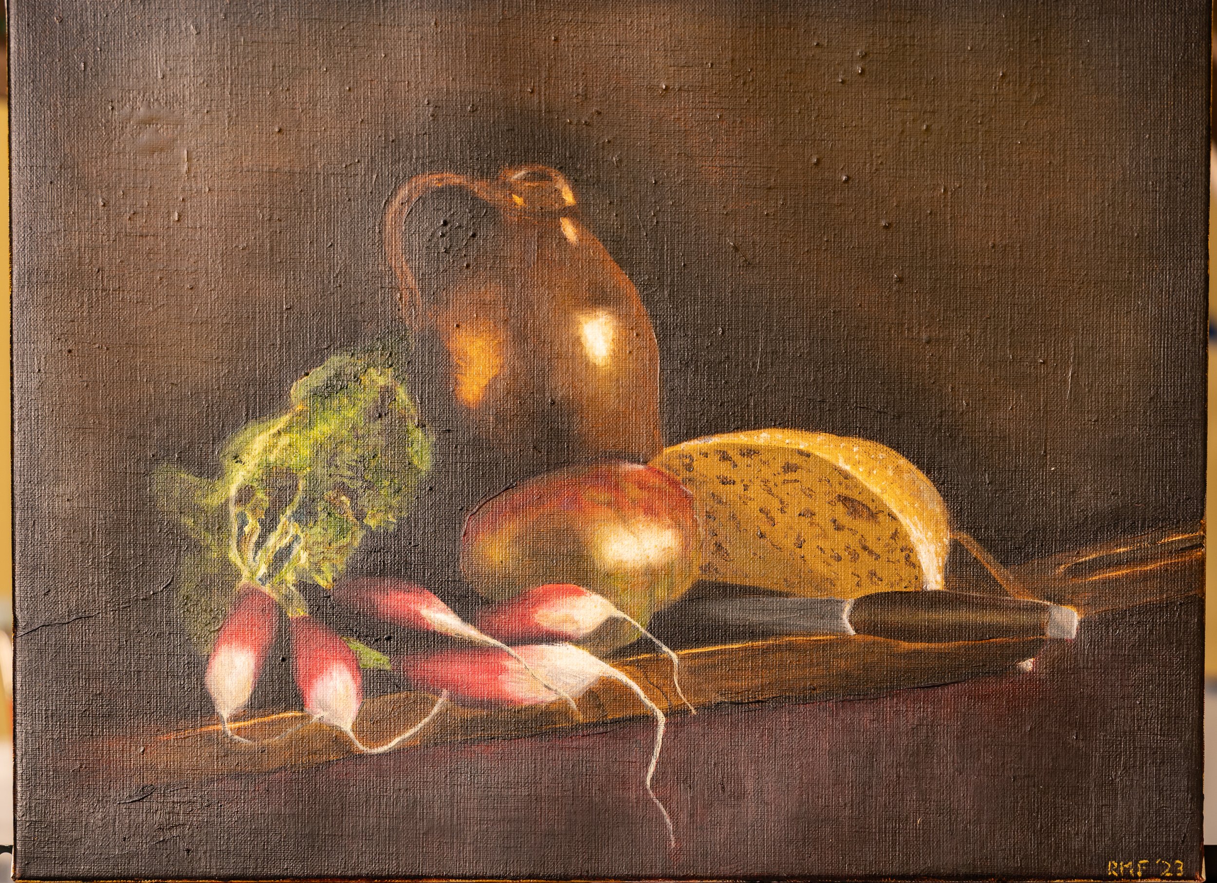 Still Life of radishes, tomato from the garden, and a loaf of fresh bread.