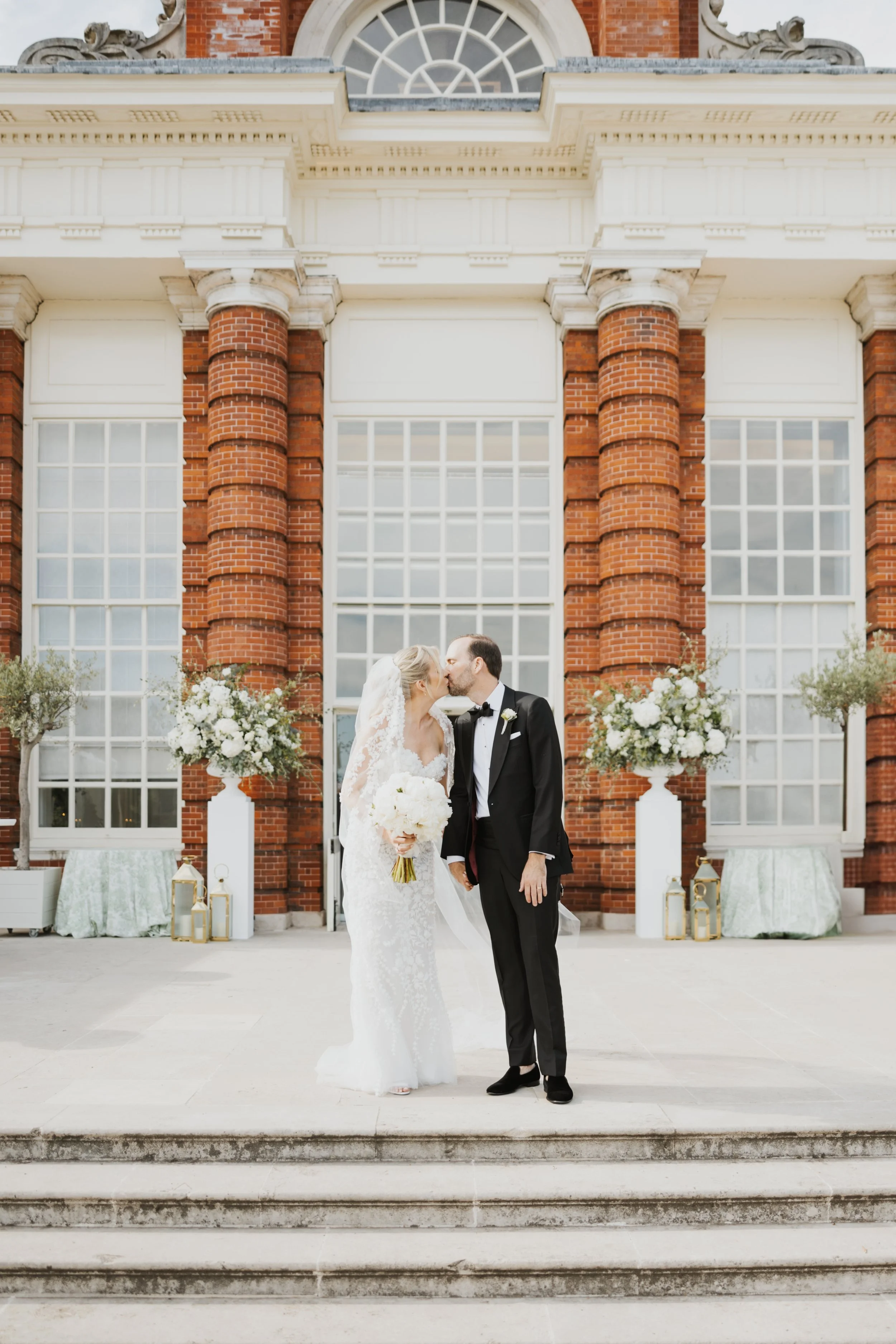 Newlyweds Mimi and Simon sharing an intimate moment inside the Kensington Palace Orangery on their wedding day