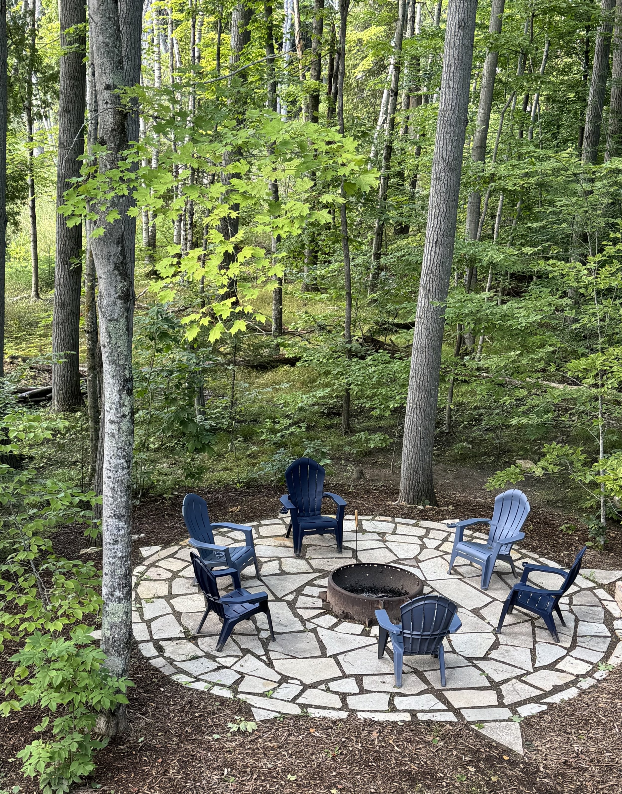 View of fire pit area from upstairs bedroom