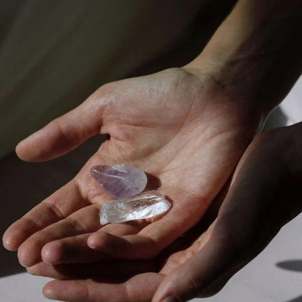 Intuitive Reading with Crystals Hands holding crystals representing an intuitive crystal reading for spiritual clarity and insight