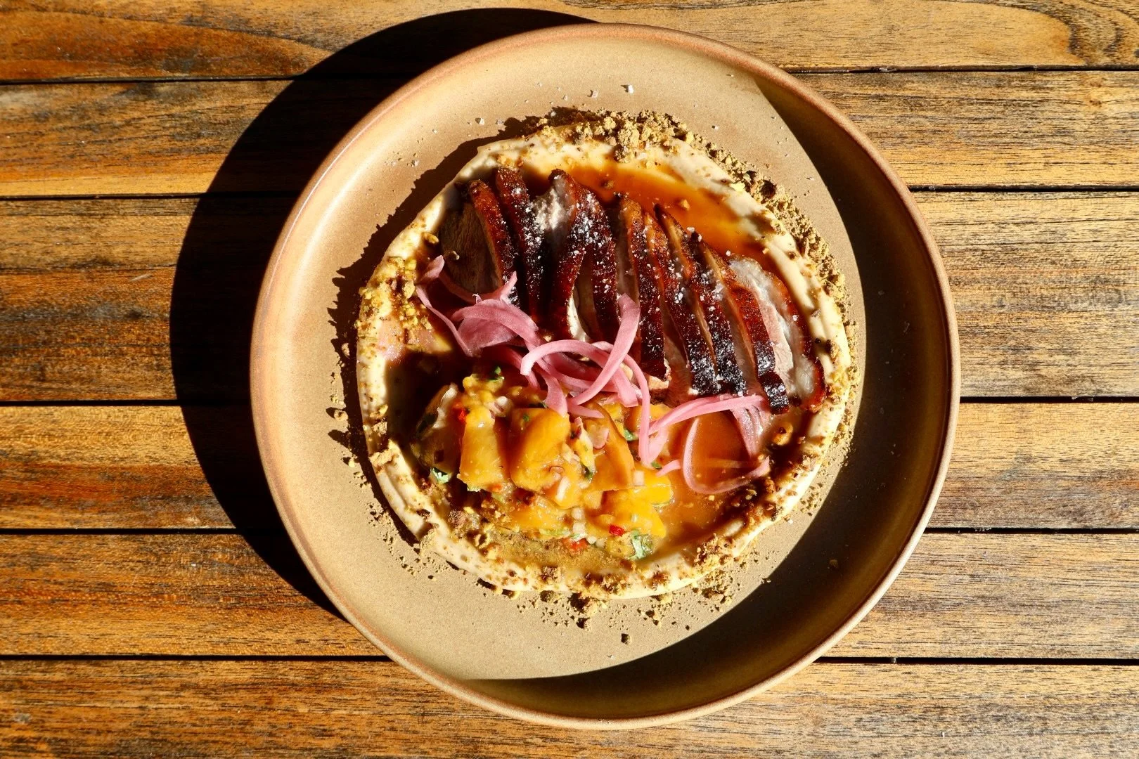A little different to your classic Panang curry. 
Panang duck with spiced cauliflower pur&eacute;e, pistachio, mango sambal, and a rich panang gastrique. Familiar flavours, done our way.
